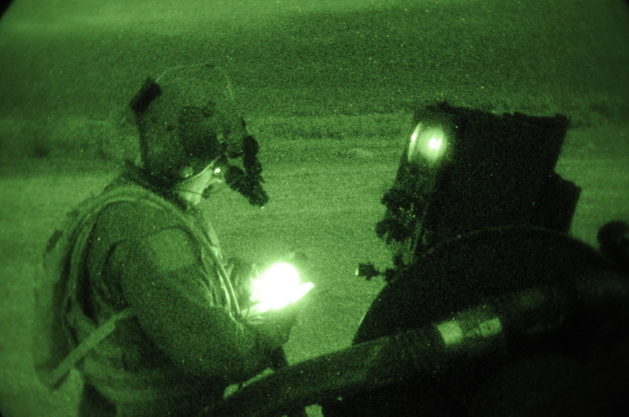 IE SHIMA AIRFIELD, Japan -- Staff Sgt. Jason Lemke, reviews a checklist as he monitors gauges on a forward area manifold cart connected to a MC-130H Combat Talon II  and a U.S. Marine Corps CH-46E Sea Knight helicopter during a refueling mission at a forward area refueling point here Jan. 20 as part of Beverly High 11-02, a local operational readiness exercise. FARP specialists and loadmasters utilize a forward area manifold cart to transfer fuel from one aircraft to another in hostile and austere environments. Members of the 353rd SOG are participating in the exercise to hone their warfighting skills in preparation for a headquarters inspection next month.  (U.S. Air Force photo by Tech. Sgt. Aaron Cram)