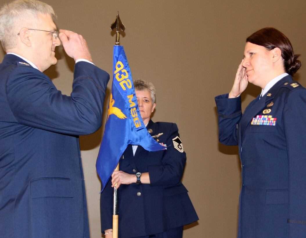 Scott Air Force Base, Il--Capt. Jodi DeDecker-Bubar salutes Col. Lynn Jobes, commander of the 932nd Mission Support Group, during assumption of command ceremonies held Jan. 22.  Captain DeDecker-Bubar is the first commander of the 932nd Security Forces Squadron, which was recently activated. The new 932nd SFS is part of the 932nd Airllift Wing, which flies the C-40 and C-9C aircraft.  