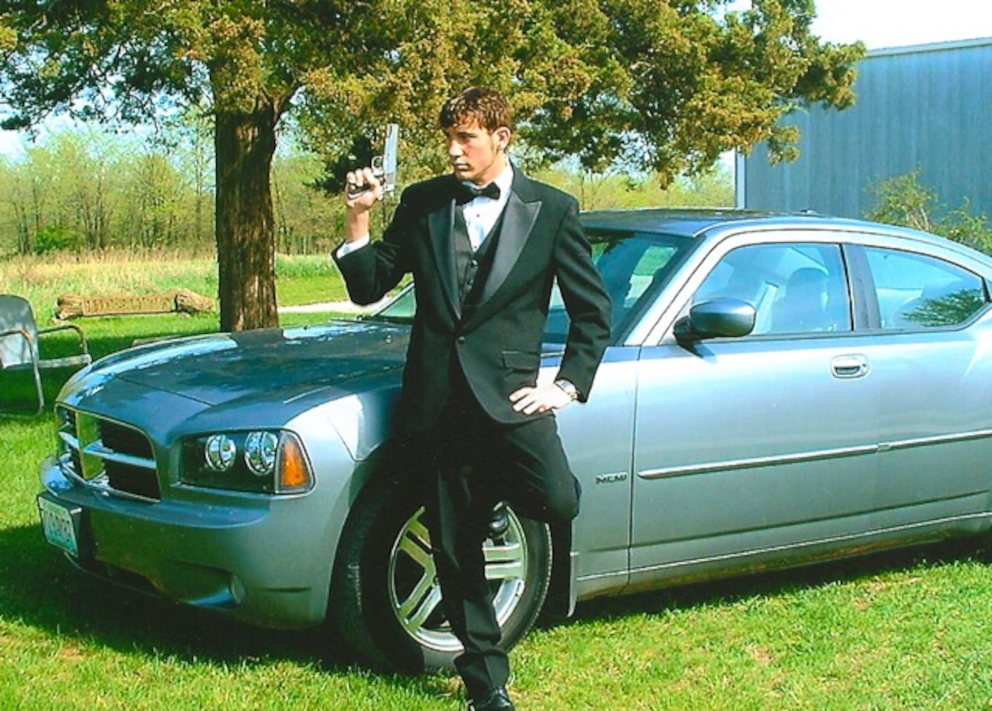 U.S. Air Force Senior Airman Nicholas Rogers, service desk analyst with Contingency Operating Base Speicher’s direct support signal team, poses for a photo before his high school prom. The Gallatin, Mo., native is deployed to Iraq from the 375th Communications Squadron at Scott Air Force Base, Ill. (Courtesy photo)