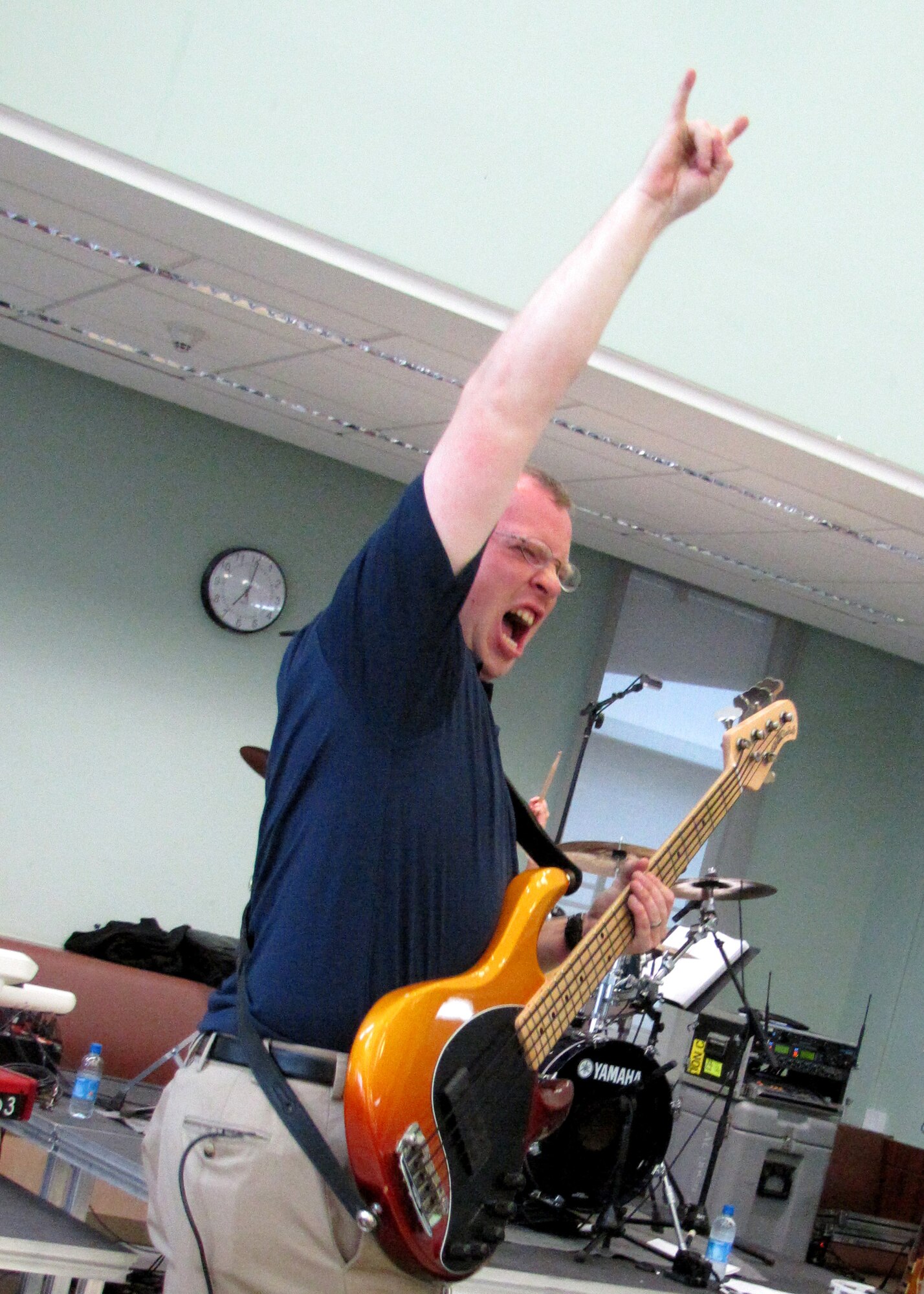 Bass player, Senior Airman Brian Plank, performs with Starlifter, the U.S. Air Forces Central Band, for approximately 600 students in an American secondary school at an undisclosed location in Southwest Asia, Jan. 19. (U.S. Air Force photo by Staff Sgt. Angelique N. Smythe) 

