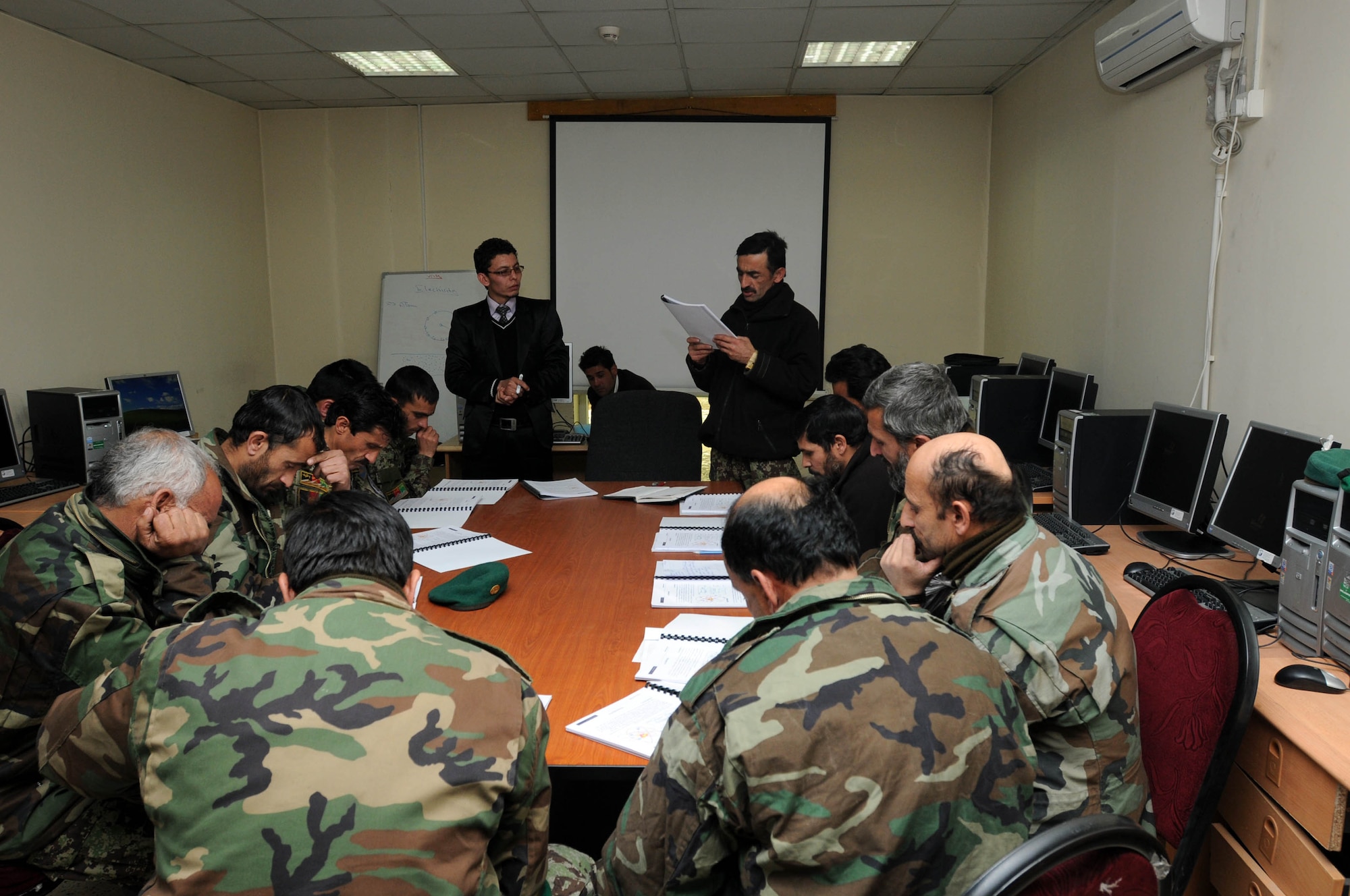 KABUL, Afghanistan - Members of the Afghan Air Force attend a new computer training course called A+ training at the Afghan Air Force Base in Kabul, Afghanistan Jan.17. (U.S. Navy photo by Mass Communications Specialist 3rd Class Petty Officer Jared E. Walker/ RELEASED).