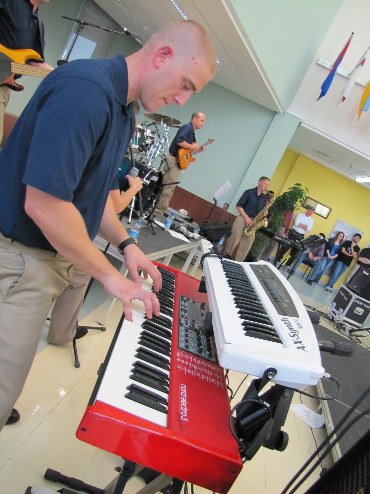 Pianist, Senior Airman Adam Braatz, plays during a performance by Starlifter, the U.S. Air Forces Central Band, for approximately 600 students in an American secondary school at an undisclosed location in Southwest Asia, Jan. 19. (U.S. Air Force photo by Staff Sgt. Angelique N. Smythe)
