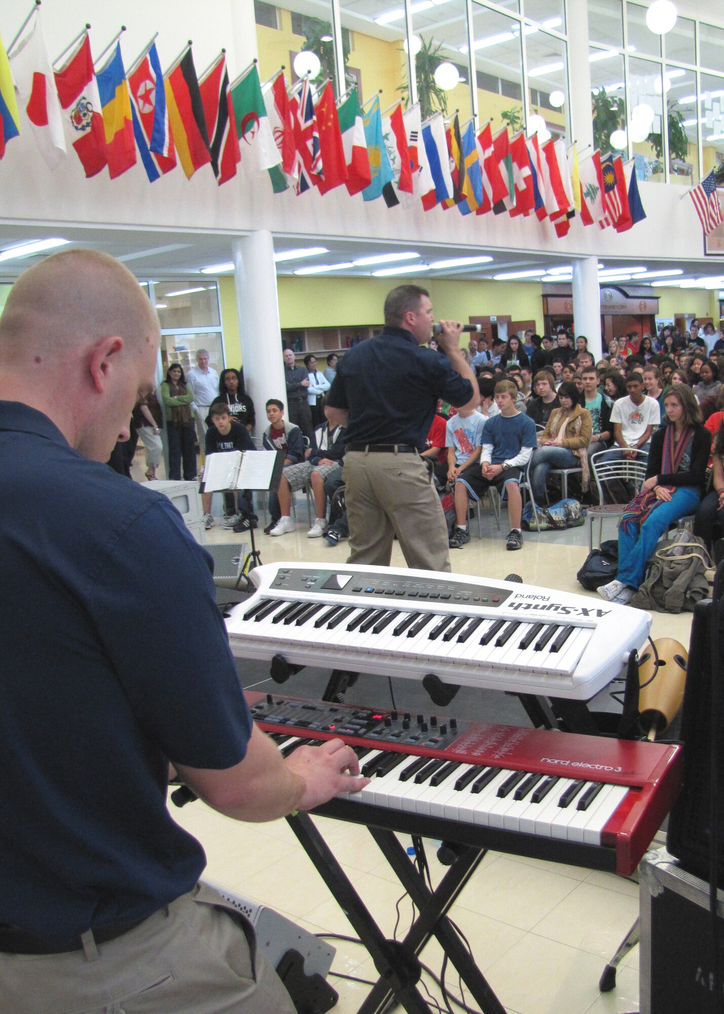 Approximately 600 students in an American secondary school at an undisclosed location in Southwest Asia gathered in their cafeteria for a live performance by the U.S. Air Forces Central rock band, Starlifter, Jan. 19. (U.S. Air Force photo by Staff Sgt. Angelique N. Smythe)

