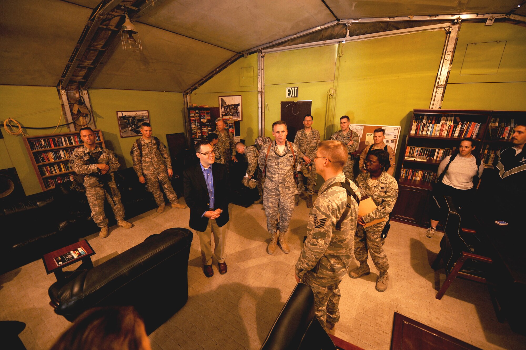 Daniel Ginsberg, the Assistant Secretary of the Air Force for Manpower and Reserve Affairs, speaks with Tech. Sgt. David Milcarek, Rising Six club president, about the role of junior enlisted Airmen at Sather Air Base, Iraq, Jan. 22. Assistant Secretary Ginsberg was touring Iraq to discuss the Air Force's progress in the drawdown of U.S. forces in country. (U.S. Air Force photo by Staff Sgt. Levi Riendeau)