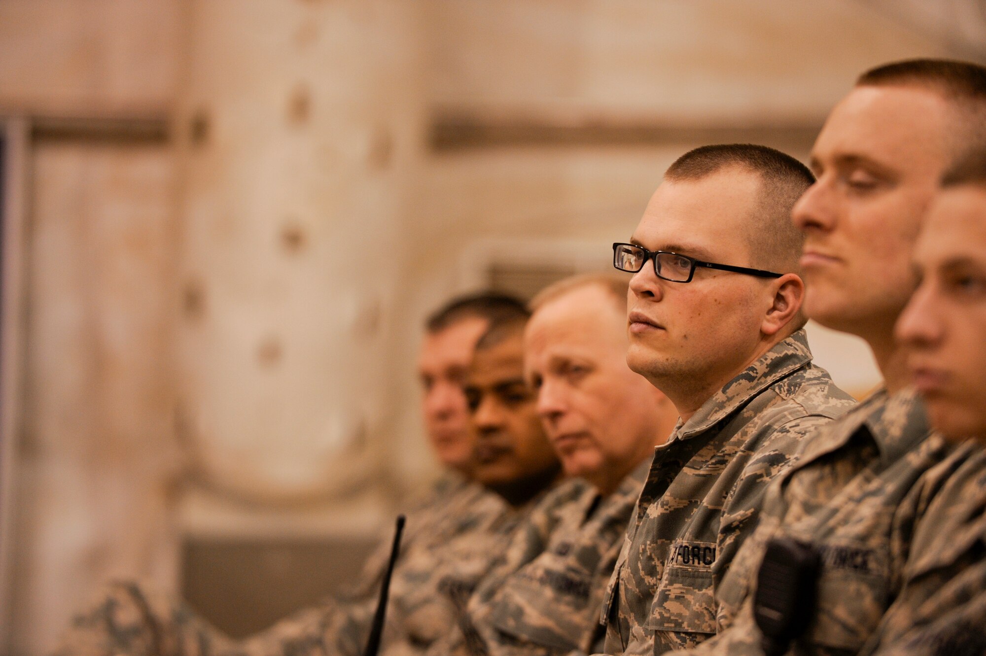 Airmen from Sather Air Base listen to Daniel Ginsberg, the Assistant Secretary of the Air Force for Manpower and Reserve Affairs, during his speech in Baghdad, Iraq, Jan. 21. Assistant Secretary Ginsberg was touring Iraq to discuss the Air Force's progress in the drawdown of U.S. forces in country. (U.S. Air Force photo by Staff Sgt. Levi Riendeau)
