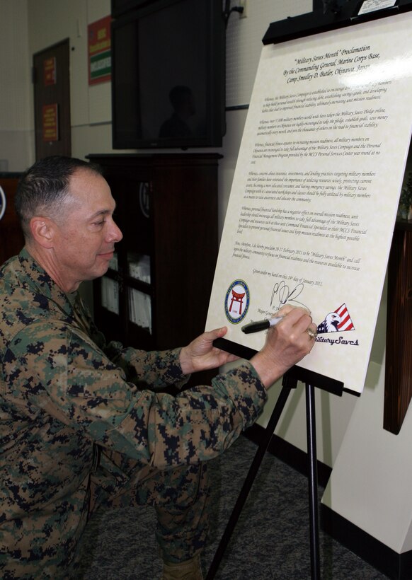 Maj. Gen. Peter J. Talleri, commanding general, Marine Corps Base Camp Smedley D. Butler, signs the Military Saves Campaign Proclamation Jan. 24, naming February as Military Saves Month. The Military Saves Campaign is a total force, command-level program which provides an opportunity for leaders at all levels to educate troops and families on the value of saving their hard-earned money to reach their long-term financial goals.