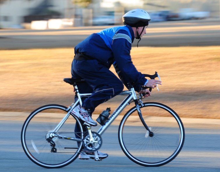 MOODY AIR FORCE BASE, Ga.-- Aaron Williams finishes a 13 mile bike ride during a Polar Bear Triathlon Jan. 22. Williams breezes through the 13 mile bike ride and proceeds to the five kilometer run, after finishing her eight laps in the pool. (U.S. Air Force photo/Senior Airman Stephanie Mancha)(RELEASED)