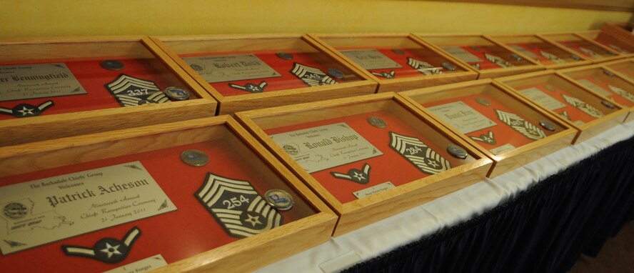 The Chief Master Sergeant Recognition Ceremony was held at the Barksdale Club, Jan. 21 to recognize 18 newly chief selects. Each honoree was presented a shadow box representing their career from an airman to a chief master sergeant. A line number was sewn in each chief master sergeant stripe. (U.S. Air Force photo/ Senior Airman Alexandra M. Boutte) (RELEASED)