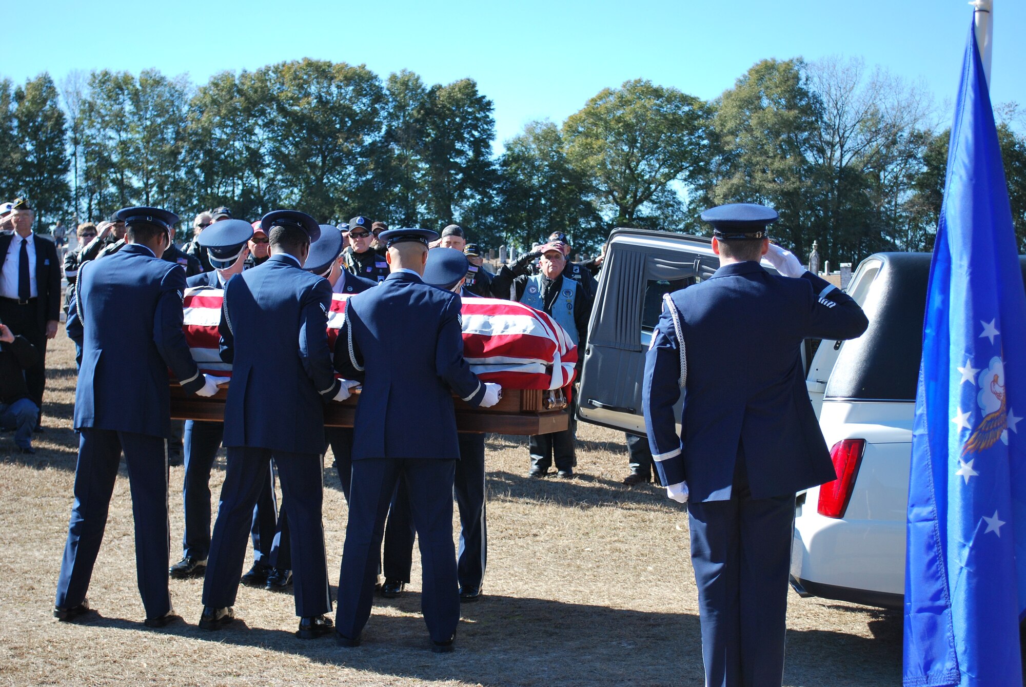 Honor Guard from Eglin Air Force Base removes the remains of 1st Lt. Robert Franklin Dees at Long Street Historical Cemetery, Ozark, Ala. (U.S. Air Force photo/Van Williams)