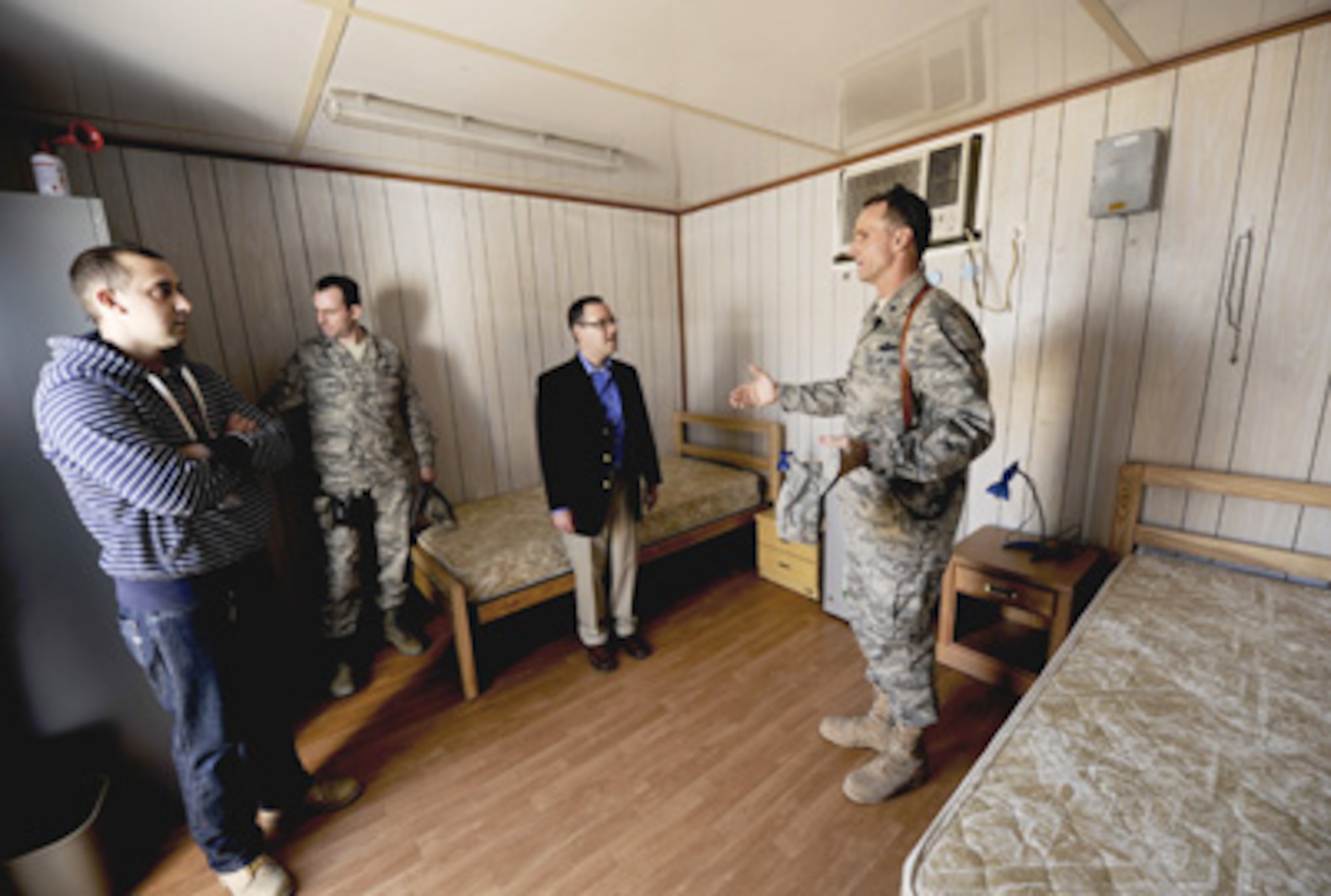 Brig. Gen. Anthony Rock shows off a containerized-housing unit to Daniel Ginsberg Jan. 21, 2011, at Sather Air Base, Iraq. Mr. Ginsberg toured Iraq to discuss the Air Force's progress in the drawdown of U.S. forces in country. General Rock is the 321st Air Expeditionary Wing commander and Iraq Training and Advisory Mission - Air director, and Mr. Ginsberg is the Assistant Secretary of the Air Force for Manpower and Reserve Affairs. (U.S. Air Force photo/Staff Sgt. Levi Riendeau) 