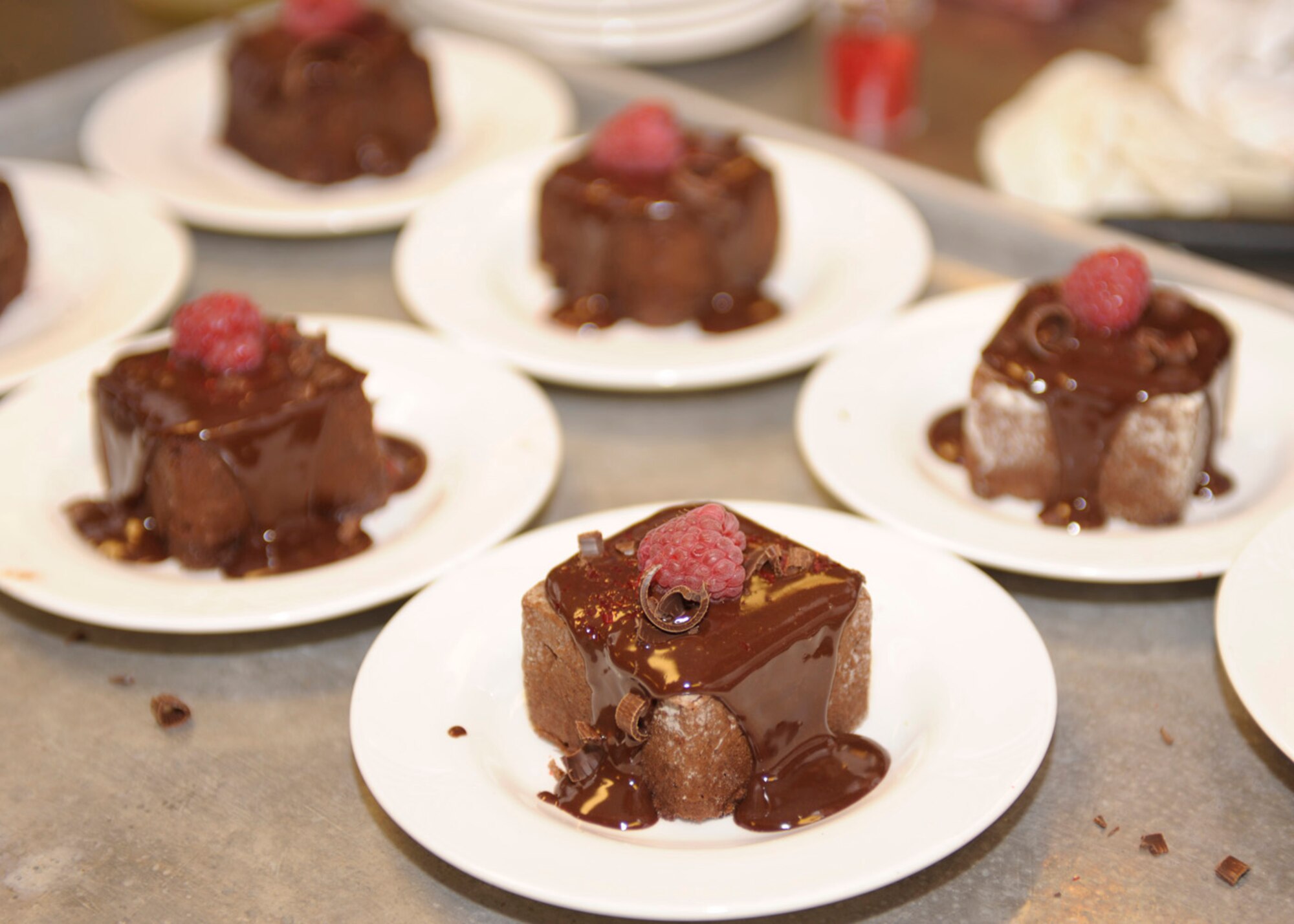 Raspberry chocolate cake awaits consumption during The Landing Zone's Iron Chef Competition January 22 at Cannon Air Force Base, N.M. The competition was between two teams that represented either The Landing Zone chefs or the Pecos Trail Dining Facility culinary artists. The fare presented by The Landing Zone was selected as the winner by the diners who attended the event. (U.S. Air Force Photo by Airman Ericka Engblom)