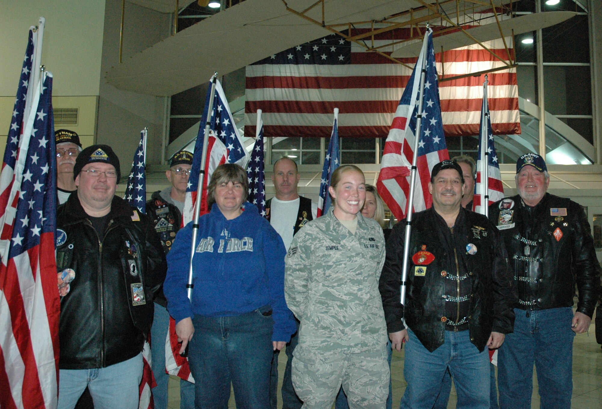 WRIGHT-PATTERSON AIR FORCE BASE, Ohio – Members of the Ohio Patriot Guard Riders welcome home Senior Airman Emily Temple, 445th Logistics Readiness Squadron, at the Dayton International Airport Jan. 23. Airman Temple returned from a six-month deployment to Joint Base Balad, Iraq, where she was assigned to the 332nd Expeditionary Logistics Readiness Squadron.  (U.S. Air Force photo/Master Sgt. John Koehl)