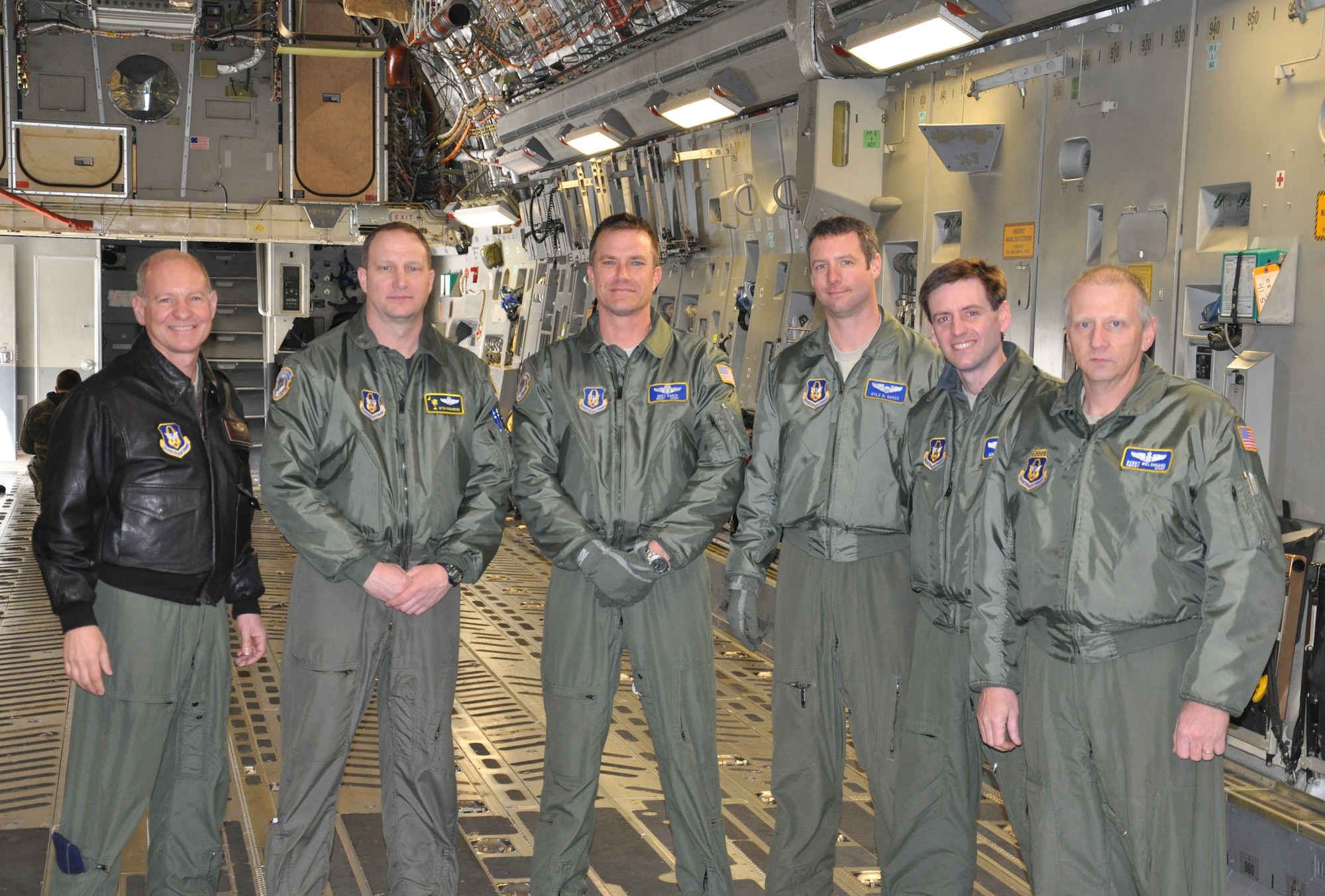 WRIGHT-PATTERSON AIR FORCE BASE, Ohio – Although it’s on loan from Joint Base Charleston, S.C., the 445th Airlift Wing’s first C-17 Globemaster III arrived Jan. 21. Reservists from the wing were part of the crew that flew in the aircraft. The crew consisted of (from left to right) Lt. Col. Clay Pittman, 89th Airlift Squadron; Lt. Col. Mitch Richardson, 317th Airlift Squadron; Master Sgt. Brett Baker, 89th Airlift Squadron; Capt. Kyle Hayes, 89th Airlift Squadron; Lt. Col. Mike Baker, 445th Operational Support Squadron; and Senior Master Sgt. Robert Welshhans, 445th Operations Group. (U.S. Air Force photo/Susan Belna) 