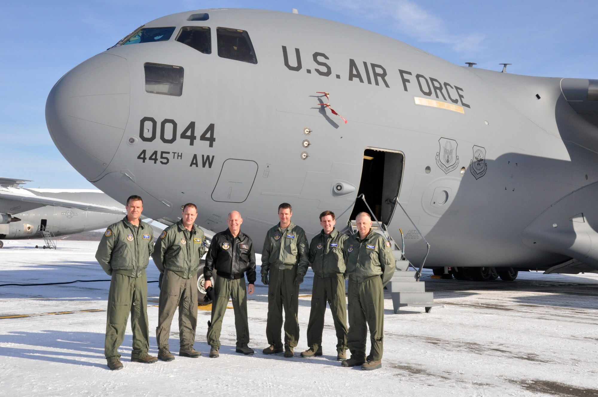 WRIGHT-PATTERSON AIR FORCE BASE, Ohio – Although it’s on loan from Joint Base Charleston, S.C., the 445th Airlift Wing’s first C-17 Globemaster III arrived Jan. 21. Reservists from the wing were part of the crew that flew in the aircraft. The crew consisted of (from left to right) Master Sgt. Brett Baker, 89th Airlift Squadron; Lt. Col. Mitch Richardson, 317th Airlift Squadron; Lt. Col. Clay Pittman, 89th Airlift Squadron; Capt. Kyle Hayes, 89th Airlift Squadron; Lt. Col. Mike Baker, 445th Operational Support Squadron; and Senior Master Sgt. Robert Welshhans, 445th Operations Group. (U.S. Air Force photo/Susan Belna) 