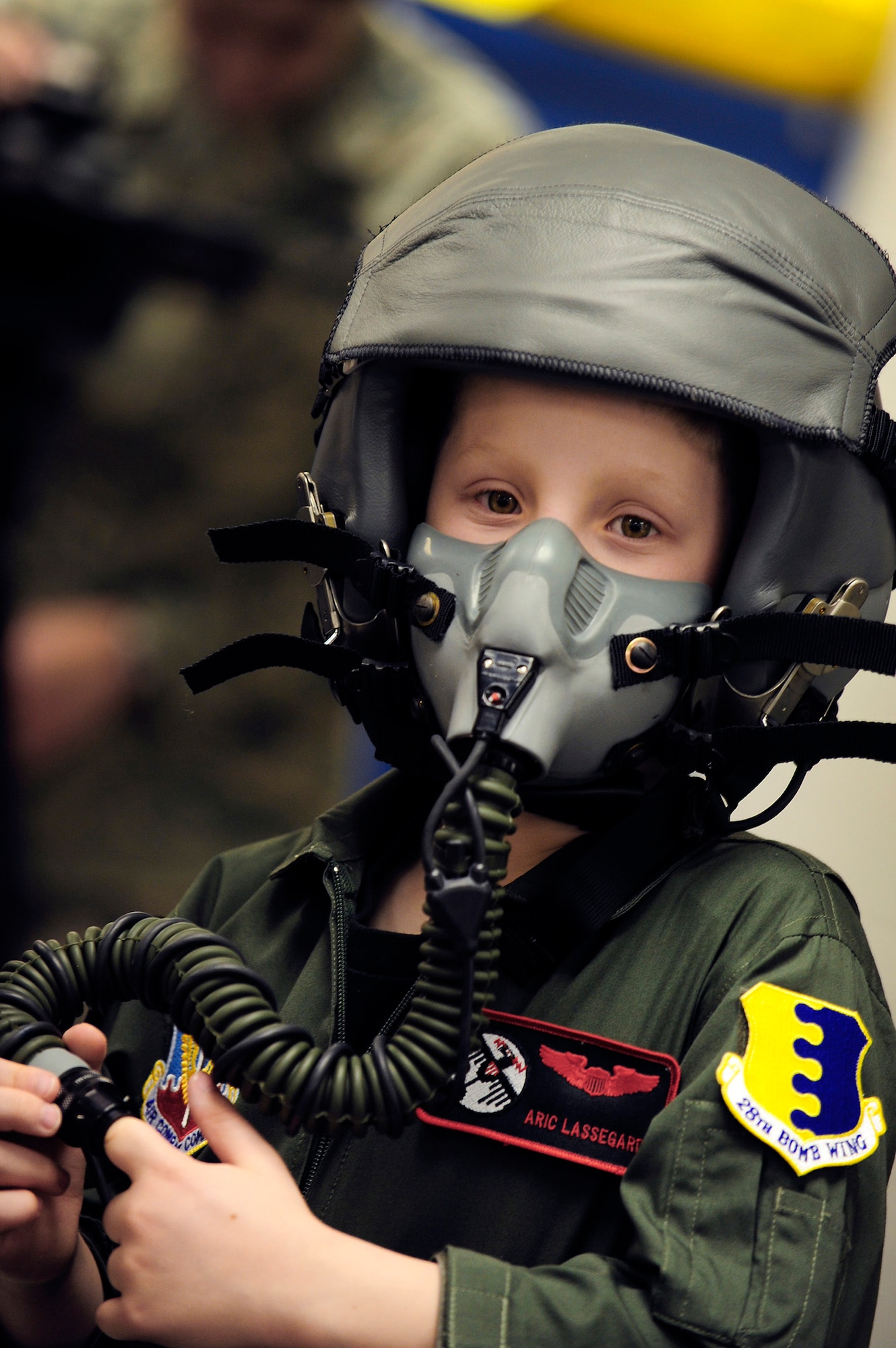 Aric Lassegard wears an HGU-55/P aircrew helmet with the MBU-12/P oxygen mask attached Jan. 13, 2011, at Ellsworth Air Force Base, S.D. Aric was treated as an honorary member of the 34th BS as part of the Aircrew for a Day program. (U.S. Air Force photo/Staff Sgt. Marc I. Lane)