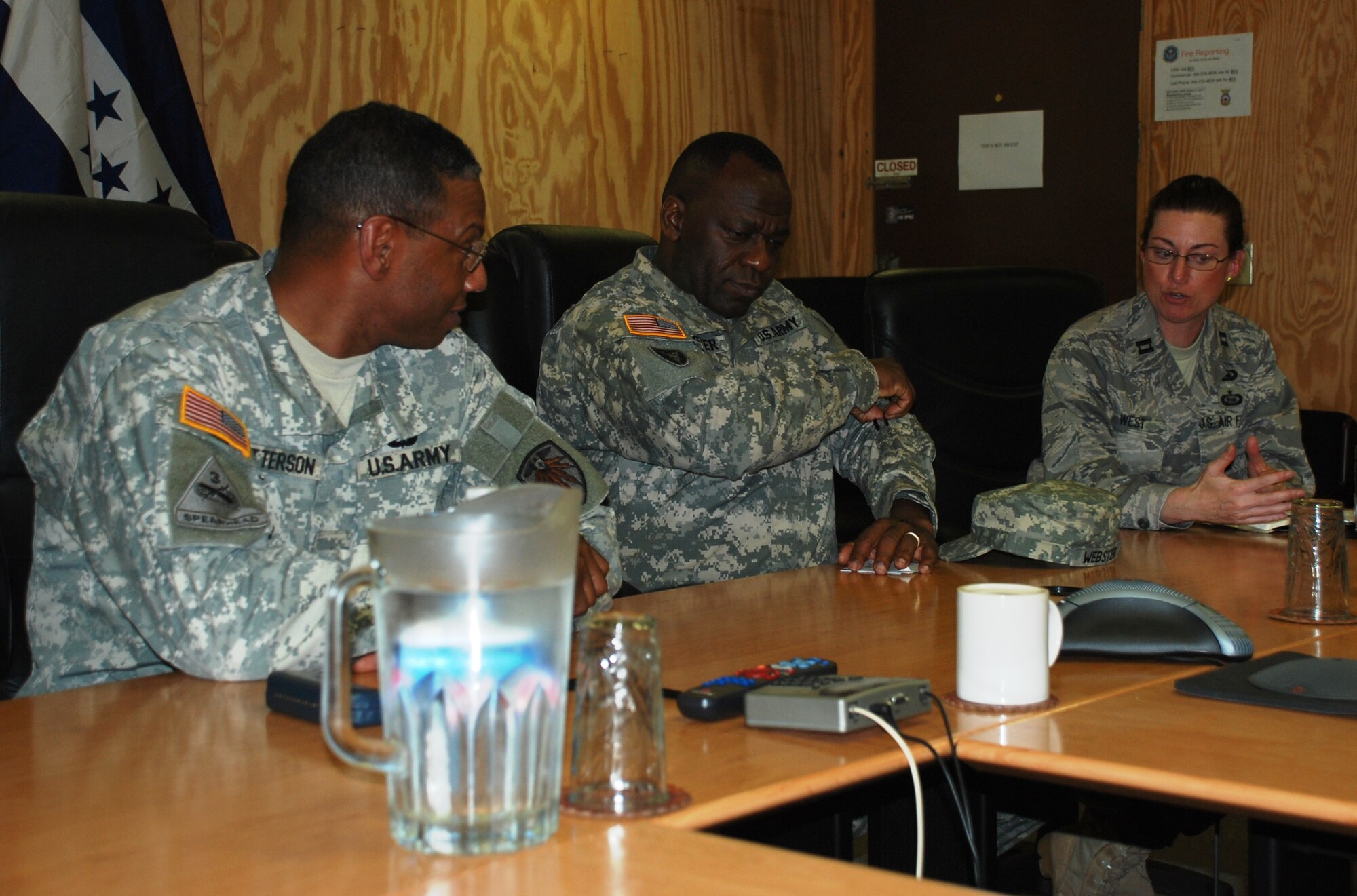 SOTO CANO AIR BASE, Honduras -  Brig. Gen. LaWarren V. Patterson (left), Commanding General of the 7th Signal Command out of Fort Gordon, Ga., ponders an information systems protection question from Joint Task Force-Bravo Director of Communications Capt. Kelly West (right) here, 21 Jan.  General Patterson manages all Army network operations in the Western Hemisphere.  He and his leadership team we're here to immerse themselves in the JTF-B mission to identify how better they could better assist/support current information technology requirements. (U.S. Air Force photo/Capt. John T. Stamm)