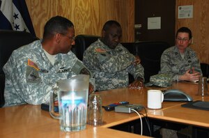 SOTO CANO AIR BASE, Honduras -  Brig. Gen. LaWarren V. Patterson (left), Commanding General of the 7th Signal Command out of Fort Gordon, Ga., ponders an information systems protection question from Joint Task Force-Bravo Director of Communications Capt. Kelly West (right) here, 21 Jan.  General Patterson manages all Army network operations in the Western Hemisphere.  He and his leadership team we're here to immerse themselves in the JTF-B mission to identify how better they could better assist/support current information technology requirements. (U.S. Air Force photo/Capt. John T. Stamm)