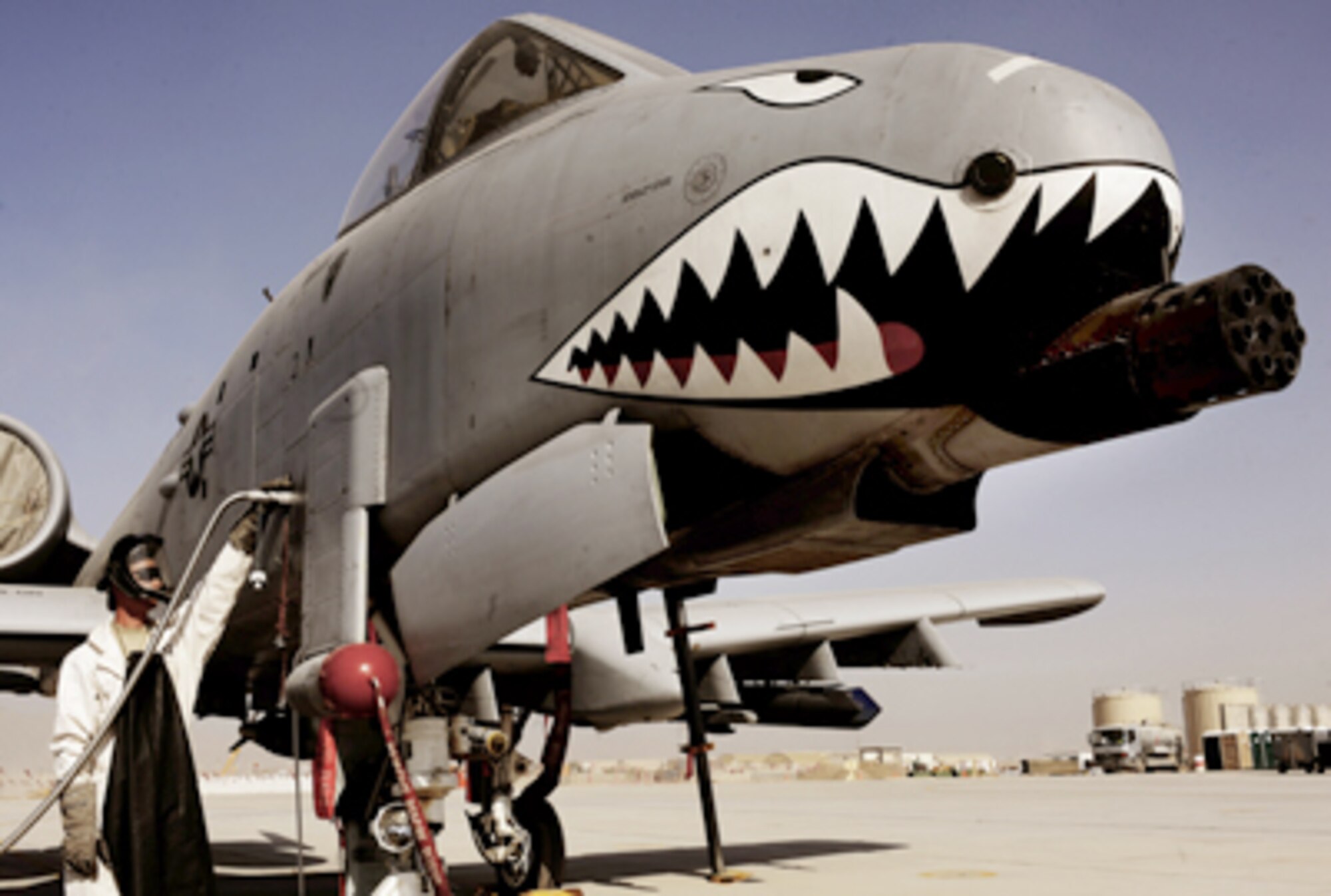 Staff Sgt. Tom Wilson fills an A-10C Thunderbolt II with liquid oxygen, Jan. 11, 2011, at Kandahar Airfield, Afghanistan. The 75th Expeditionary Fighter Squadron recently moved their assets to the other side of the flightline, marking the first of many moves toward consolidating the wing's missions. Sergeant Wilson is a crew chief assigned to the 451st Expeditionary Aircraft Maintenance Squadron. (U.S. Air Force photo/Senior Airman Willard E. Grande II)