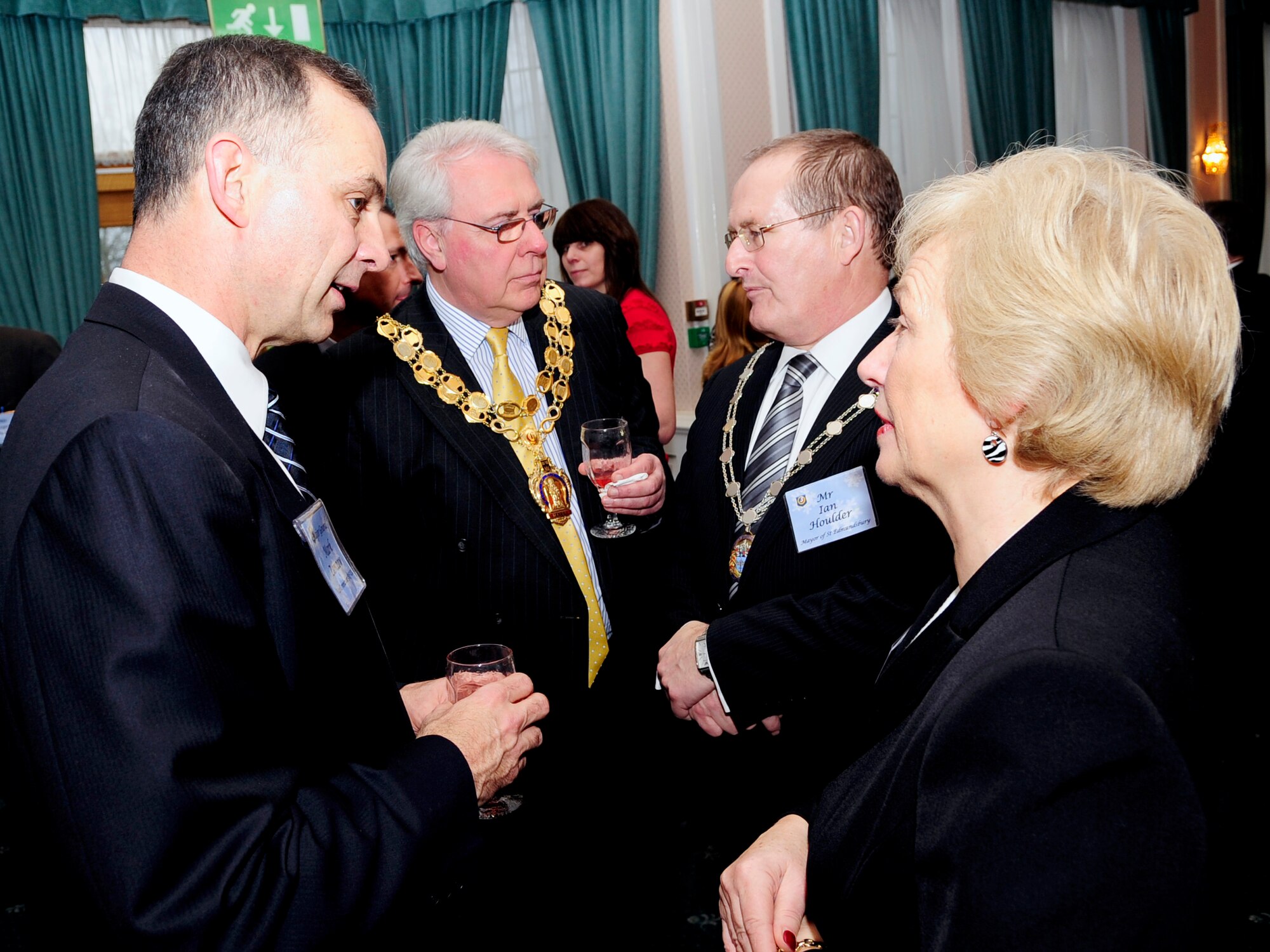 RAF MILDENHALL, England -- Maj. Gen. Mark Zamzow, 3rd Air Force vice commander, Brian Ashton, mayor of the City of Ely, Ian Houlder, mayor of St. Edmundsbury, and Jenny Bradin, secretary to the mayor of St. Edmundsbury, talk with each other  during the 3rd Air Force Winter Reception here Jan. 15, 2011. The reception gave Air Force and British nationals a chance to strengthen international relationships. (U.S. Air Force photo/Senior Airman Ethan Morgan) 