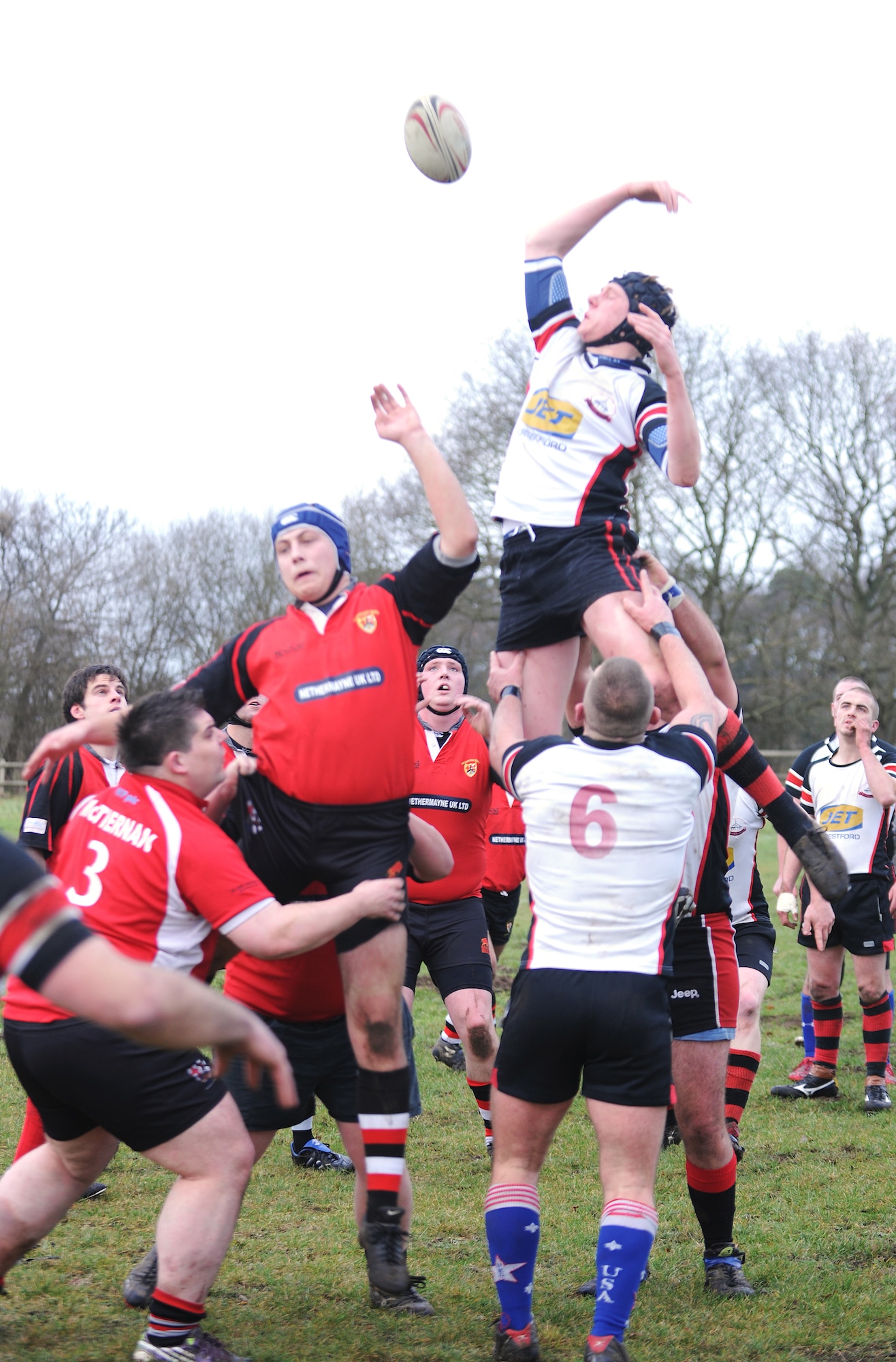 RAF MILDENHALL, England -- The Mildenhall Rugby Union Football Club and the Felixstowe RUFC compete for the ball during a line out at Jenner's Field in Holywell Row Jan. 22, 2011.  The Mildenhall RUFC is made up of British and American players from the local area. (U.S. Air Force photo/Senior Airman Tabitha M. Lee)