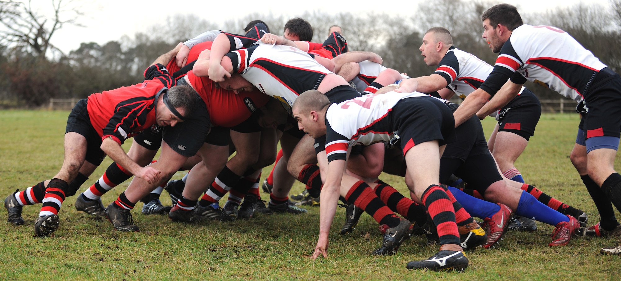 RAF MILDENHALL, England -- The Mildenhall Rugby Union Football Club and the Felixstowe RUFC compete for control of the ball in a scrum at Jenner's Field in Holywell Row Jan. 22, 2011.  The Mildenhall RUFC is made up of British and American players from the local area. (U.S. Air Force photo/Senior Airman Tabitha M. Lee) 