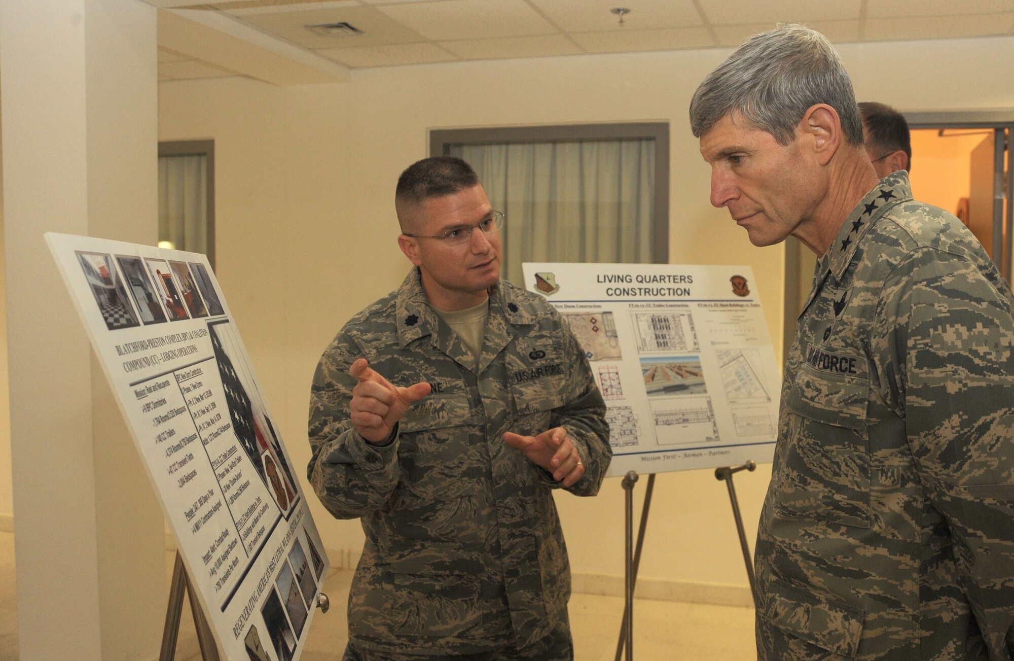 Lt. Col. Nathan Chine, 379th Expeditionary Force Support Squadron commander,  briefs Air Force Chief of Staff Gen. Norton Schwartz on the living quarters conditions and future construction plans during his visit to Southwest Asia, Jan. 17. General Schwartz toured work areas, visited with Airmen around the base and addressed issues affecting the Air Force.  (U.S. Air Force photo/Staff Sergeant Liliana Moreno) (RELEASED)                                                                           