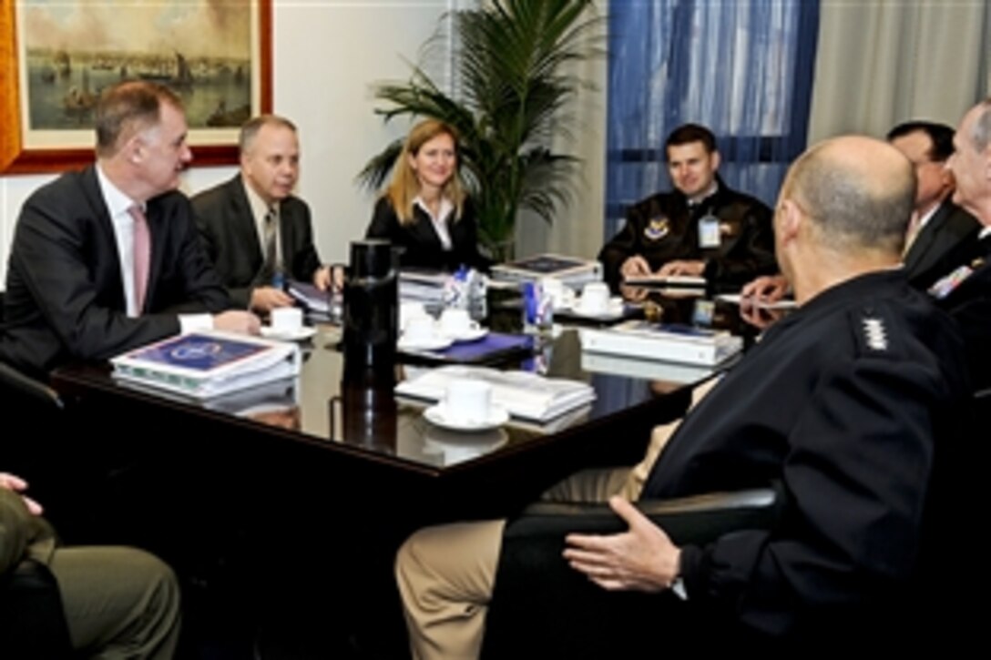 U.S. Deputy Defense Secretary William J. Lynn III, left, meets with U.S. Navy Adm. James G. Stavridis, front right, NATO's supreme allied commander for Europe, and his staff at NATO headquarters in Brussels, Belgium, Jan. 24, 2011.