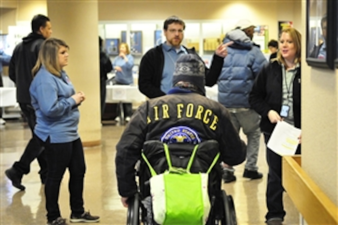 Volunteers help a U.S. Air Force homeless veteran determine what services he needs at the 15th annual Winterhaven Homeless Stand Down at the Veterans Affairs Medical Center in Washington, D.C., Jan. 22, 2011. More than 500 veterans attended the event, receiving clothes and information on employment, claims, health care, income tax education, homeless outreach programs, housing opportunities and social services.