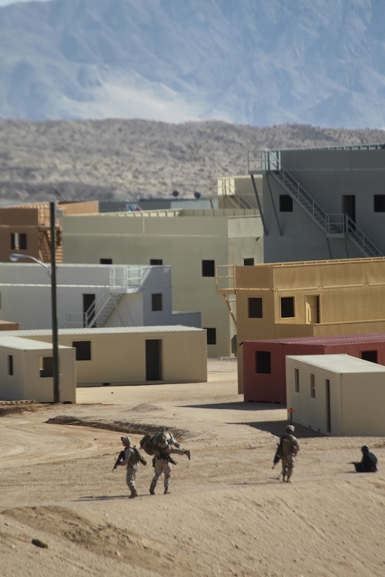 Marines carry a simulated casualty at Range 220 here Jan. 25, 2011, during training at the Marine Corps’ newest Combined Arms Military Operations on Urban Terrain range complex. The $170 million project encompasses 274 acres of training space organized into seven separate mock city districts. The layout of the city confronts Marines with a full range of tactical challenges from humanitarian relief efforts to peacekeeping and law enforcement to direct combat, all of which can take place in a tightly compressed “real world” timeline known to Marines as the “three block war.” The new range is the largest of its kind in the Marine Corps.