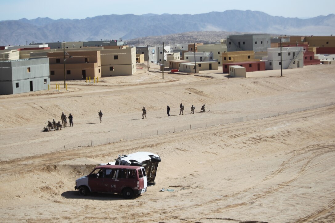 Marines from 1st Battalion, 5th Marines, Camp Pendleton, Calif., patrol through the 274-acre Combined Arms Military Operations on Urban Terrain range complex Jan. 25, 2011, while training at Enhanced Mojave Viper, here. In a ribbon cutting ceremony earlier in the day, Brig. Gen. H. Stacy Clardy III, the Combat Center’s commanding general, officially unveiled facility, the Corps’ newest and largest complex of its kind.