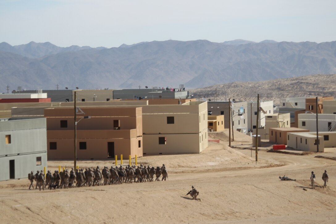 Marines from 1st Battalion, 5th Marines, Camp Pendleton, Calif., take part in Enhanced Mojave Viper, a pre-deployment training exercise at the 274-acre Combined Arms Military Operations on Urban Terrain complex at Range 220 here Jan. 25, 2011.  The facility, the Corps’ newest and largest range of its kind, was unveiled earlier that day with a ribbon cutting ceremony, attended by Brig. Gen. H. Stacy Clardy III, the Combat Center’s commanding general.