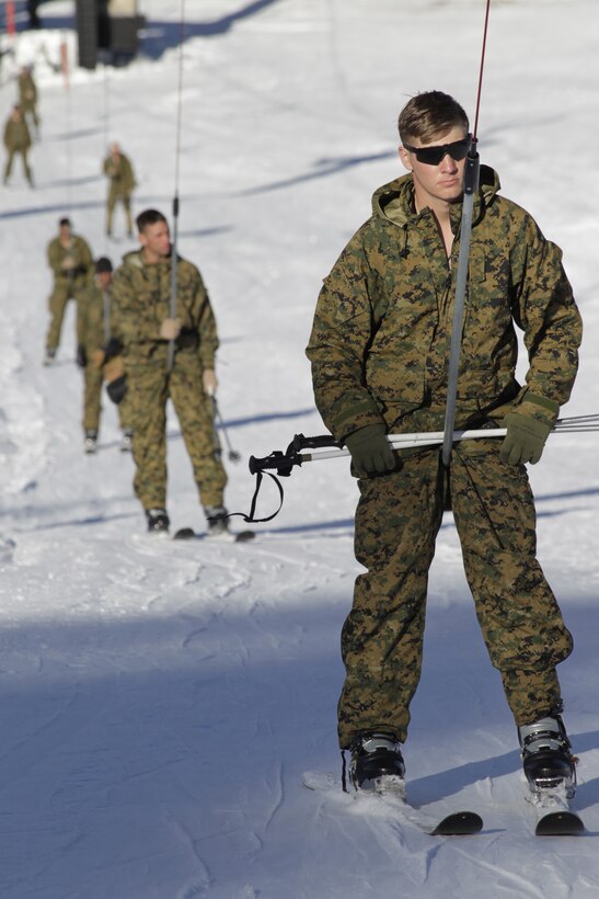 Marines in the Scout Skiers Course ride the tow line to the top of the slope Jan. 25, 2011, at the Marine Corps Mountain Warfare Training Center, Bridgeport, Calif.
