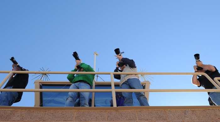 NELLIS AIR FORCE BASE, Nev. -- Photographers take photos of aircraft deployed in support of Red Flag 11-2 during an organized media day on the flightline Jan. 25. The 99th Air Base Wing Public Affairs office escorted more than 40 aviation photographers from across North America and Europe to take photos for various publications. Throughout the combined, combat training exercise the office will arrange about 13 media visits for local and national news agencies to tell the Red Flag story. (U.S. Air Force photo/Staff Sgt. Benjamin Wilson)