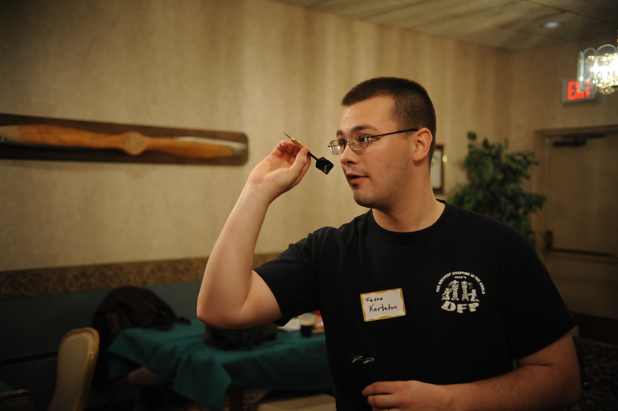 MINOT AIR FORCE BASE, N.D. – Airman 1st Class Jesse Kertatos, an engineer apprentice with the 5th Civil Engineer Squadron, prepares to throw a dart during the dart tournament held at the 46th Annual Team Minot Sportsmen Feed held at the Jimmy Doolittle Center here Jan. 23. The annual event brings Minot’s Airmen and members of the local community together for food, fun and camaraderie. (U.S. Air Force photo/Tech. Sgt. Thomas Dow)