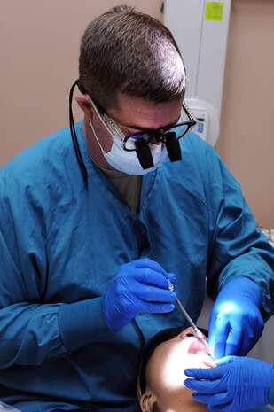 NELLIS AIR FORCE BASE, Nev.-- Maj. Matthew Huffaker, 99th Dental Squadron, dentist, prepares a patient for a crown at the Mike O'Callaghan Federal Hospital Dental Clinic Jan. 25. Maj. Huffaker assists in the Red Cross dental assistant program by instructing candidates on classroom lectures and hands-on training. (U.S. Air Force photo by Airman 1st Class Matthew Lancaster)



