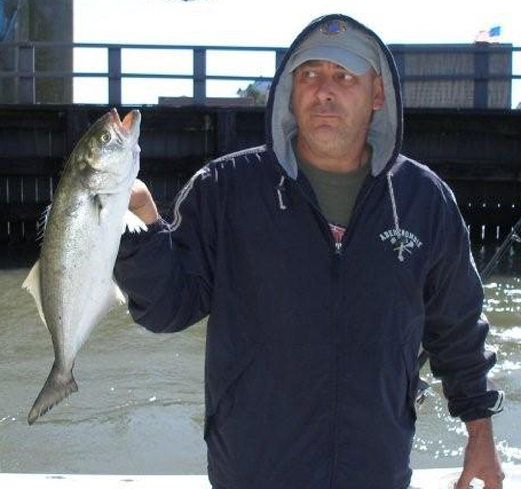 Army Staff Sgt. David DeBow, a wounded veteran from Walter Reed Medical Center, showcases a fish he caught during a special visit for wounded warriors hosted by the Ocean City Lions Club Oct. 7. 2010. The event was held to raise funds for military members wounded while overseas. To date the Lions Club has donated more than $150,000 to help supply wounded warriors with necessities after they are medically evacuated to Landstuhl Regional Medical Center, Germany.  (U.S. Air Force courtesy photo)