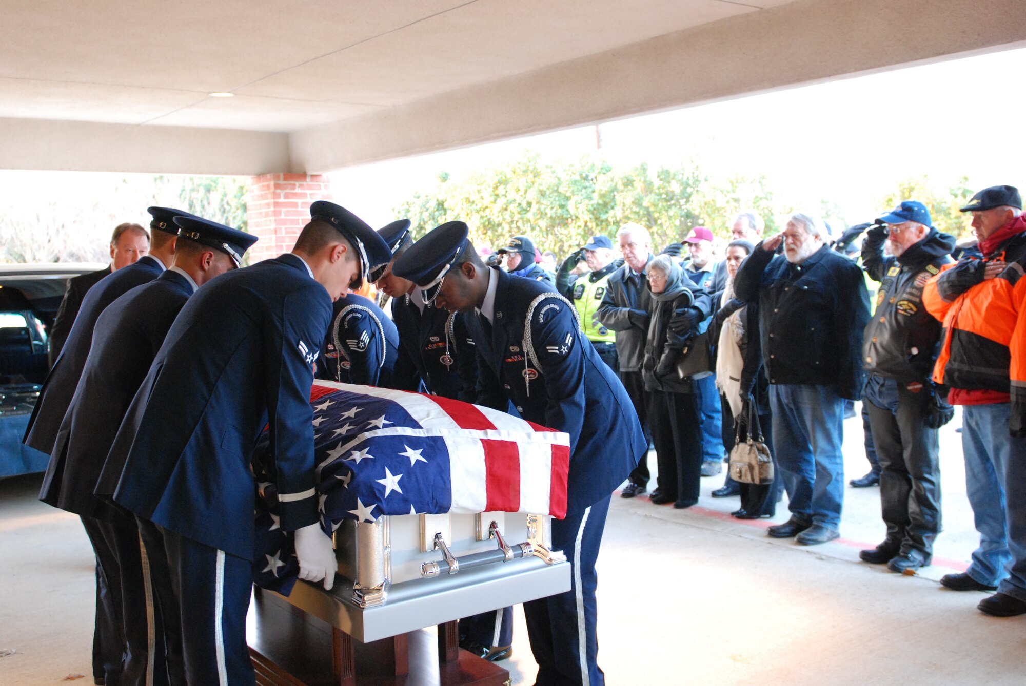MESQUITE, Texas—Honor Guard members from Dyess Air Force Base, Texas, place a casket on its stand Jan. 13 at the Laurel Oaks Funeral Home. More than 41 years ago, Col. James Dennany, 34, of Kalamazoo, Mich., and Maj. Robert Tucci, 27, of Detroit, were flying an F-4D escorting an AC-130 gunship on a night strike mission during the Vietnam War, when they were shot down by anti-aircraft gunfire. A search was conducted afterward, but revealed nothing. No other search was initiated due to heavy anti-aircraft fire in the area. In 1999, officials in Laos turned over crew-related equipment, two .38 caliber pistols and human remains. Scientists from the Joint POW/MIA Accounting Command used circumstantial evidence and forensic tools to identify the remains. Col. Dennany and Maj. Tucci were laid to rest Jan. 14 at the Dallas-Fort Worth National Cemetery. According to the Defense Prisoner of War/Missing Personnel Office, there are still 1,713 U.S. servicemen still unaccounted for from the Vietnam War. (U.S Air Force photo/ Airman 1st Class Shannon Hall)