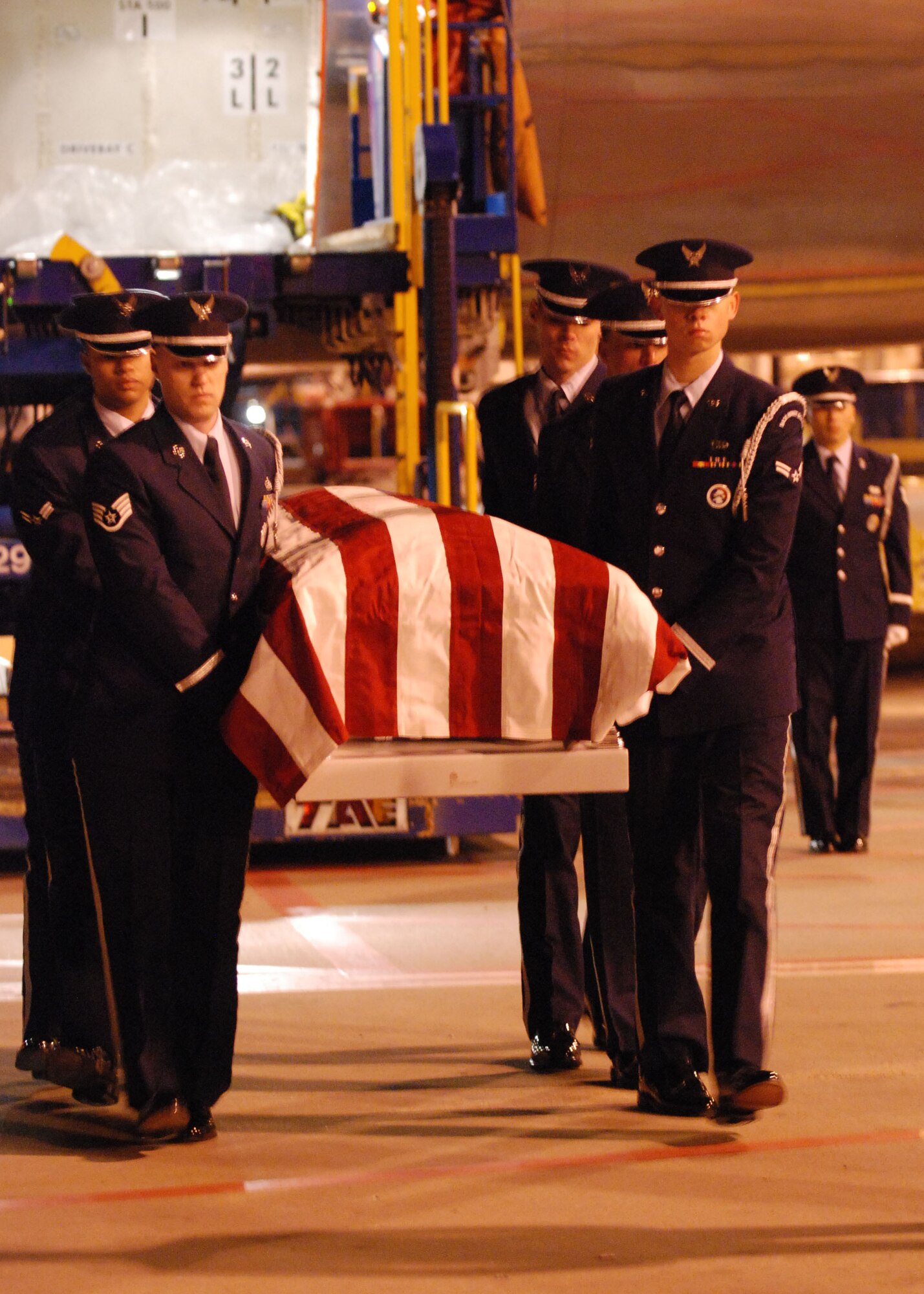 DALLAS—Honor Guard members from Dyess Air Force Base, Texas, carry a casket Jan. 13 at the Dallas/Ft. Worth International Airport. More than 41 years ago, Col. James Dennany, 34, of Kalamazoo, Mich., and Maj. Robert Tucci, 27, of Detroit, were flying an F-4D escorting an AC-130 gunship on a night strike mission during the Vietnam War, when they were shot down by anti-aircraft gunfire. A search was conducted afterward, but revealed nothing. No other search was initiated due to heavy anti-aircraft fire in the area. In 1999, officials in Laos turned over crew-related equipment, two .38 caliber pistols and human remains. Scientists from the Joint POW/MIA Accounting Command used circumstantial evidence and forensic tools to identify the remains. Col. Dennany and Maj. Tucci were laid to rest Jan. 14 at the Dallas-Fort Worth National Cemetery. According to the Defense Prisoner of War/Missing Personnel Office, there are still 1,713 U.S. servicemen still unaccounted for from the Vietnam War. (U.S Air Force photo/ Airman 1st Class Shannon Hall)