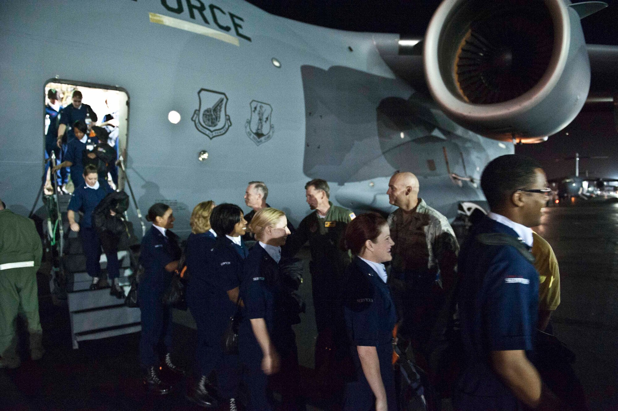 Members of Tops in Blue are greeted by Joint Base Pearl Harbor-Hickam and 15th Wing leaders upon their arrival at the 15th Wing Jan. 24. Tops In Blue is an all-active duty Air Force special unit made up of talented amateur performers selected for their individual entertainment abilities. (U.S. Air Force photo by Staff Sgt. Nathan Allen)