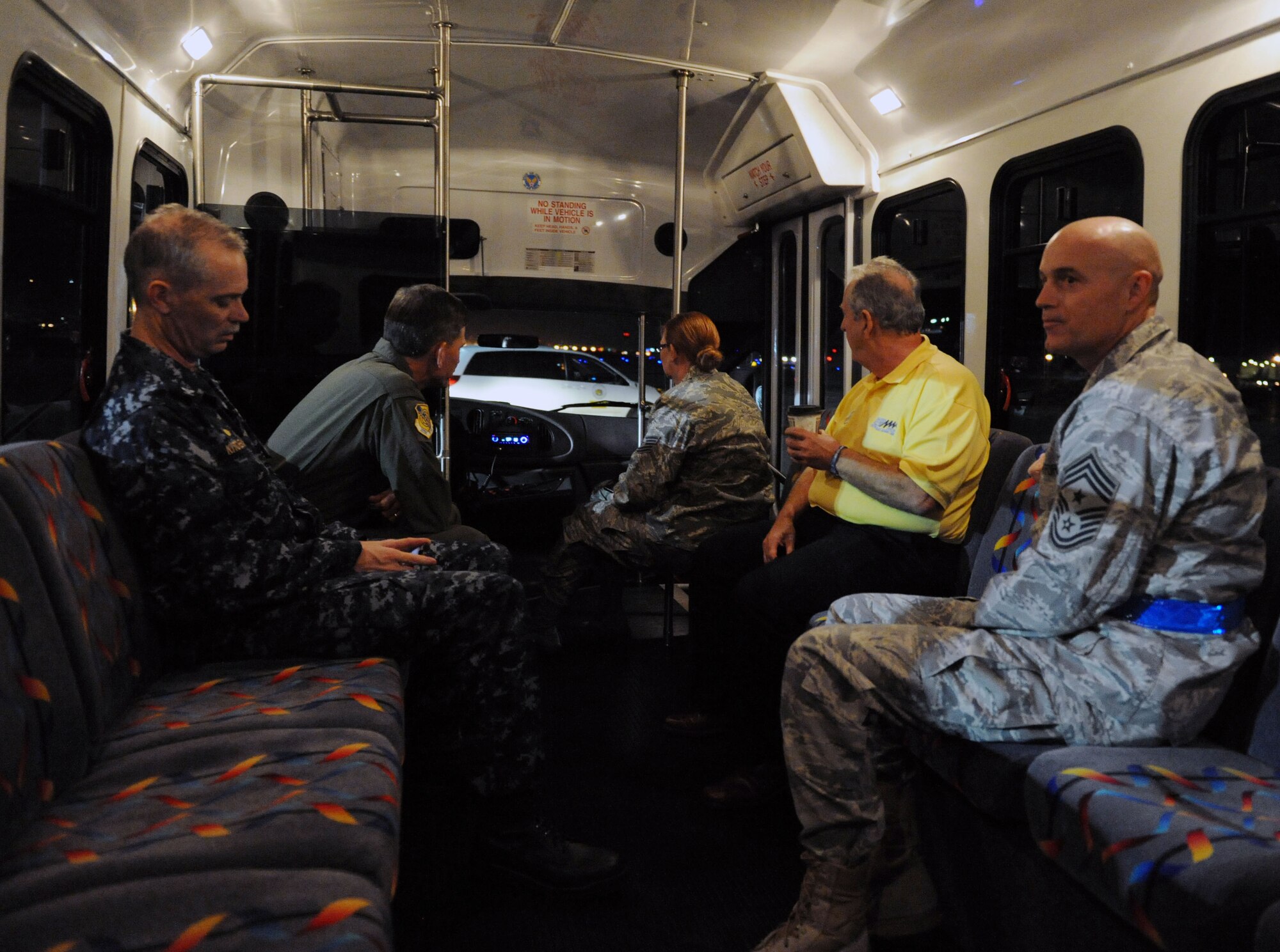(From left) U.S. Navy Capt. Richard Kitchens, Joint Base Pearl Harbor-Hickam commander, Col. Joe Dague, 15th Wing vice commander, Tech. Sgt. Shelley Standley, 15th Wing Protocol, Mr. Frank Faria, 647th Force Support Squadron deputy director, and Chief Master Sgt. Craig Recker, 15th Wing command chief, drive to parking spot C2 to greet members of Tops in Blue upon their arrival at the 15th Wing Jan 24. Tops In Blue is an all-active duty Air Force special unit made up of talented amateur performers selected for their individual entertainment abilities. (U.S. Air Force photo by Staff Sgt. Nathan Allen)