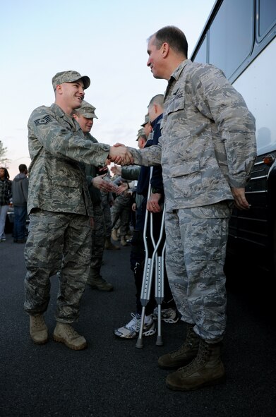 MOODY AIR FORCE BASE, Ga.-- Staff Sgt. Justin Kruel, 822nd Base Defense Squadron fire team leader, shakes hands with Col. Thomas Webster, 93rd Air Ground Operations Wing vice commander, before leaving for  a deployment to Iraq Jan. 23. Members of the 822nd BDS will travel to Fort Dix, N.J., to train before deploying to Iraq for six months. (U.S. Air Force photo/Airman 1st Class Benjamin Wiseman)(RELEASED)