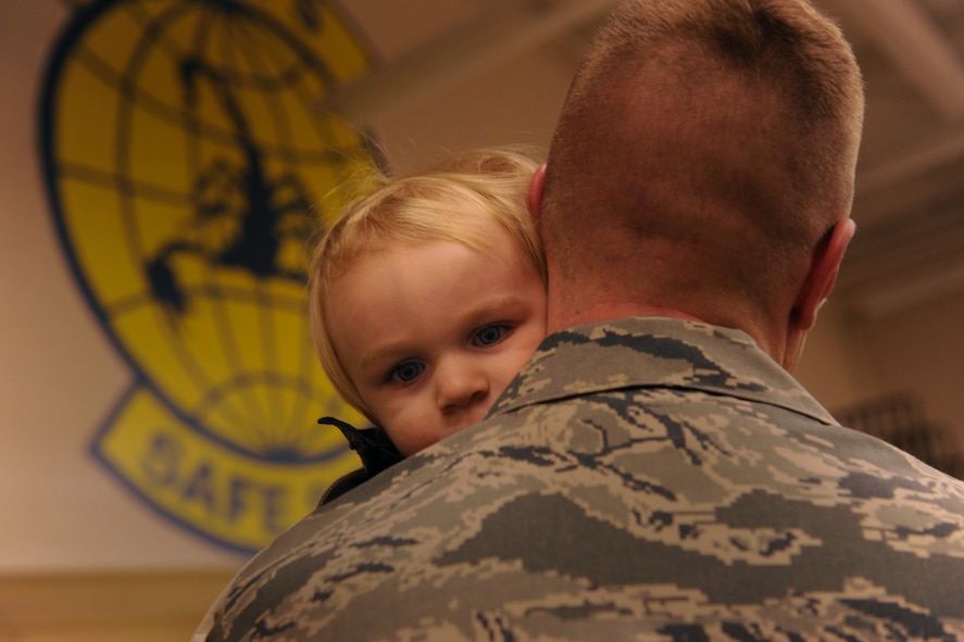 MOODY AIR FORCE BASE, Ga.-- Tech. Sgt. Jason Hera, 822nd Base Defense Squadron squad leader, gives his son Caleb one last hug before leaving for a deployment Jan. 23. The 822nd BDS will be providing a force protection mission to units who are currently deployed to Iraq. (U.S. Air Force photo/Airman 1st Class Benjamin Wiseman)(RELEASED)