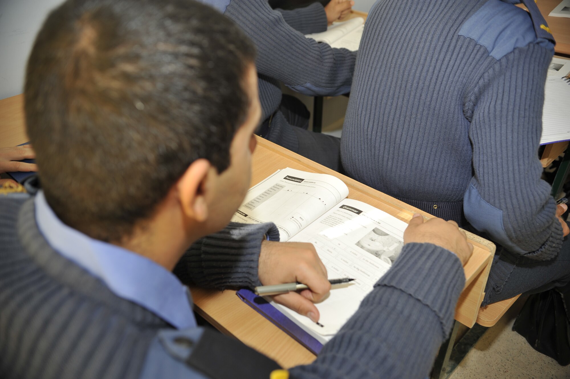 A cadet pilot in Class 76 at the Iraqi Air Force College, Tikrit, Iraq, listens to an English lesson. The college is the equivalent of the U.S. Air Force Academy for Iraqi officers. 151 cadet pilots began their training when the school reopened Sept. 1, 2010. (U.S. Air Force photo by Senior Master Sgt. Larry Schneck/Released)