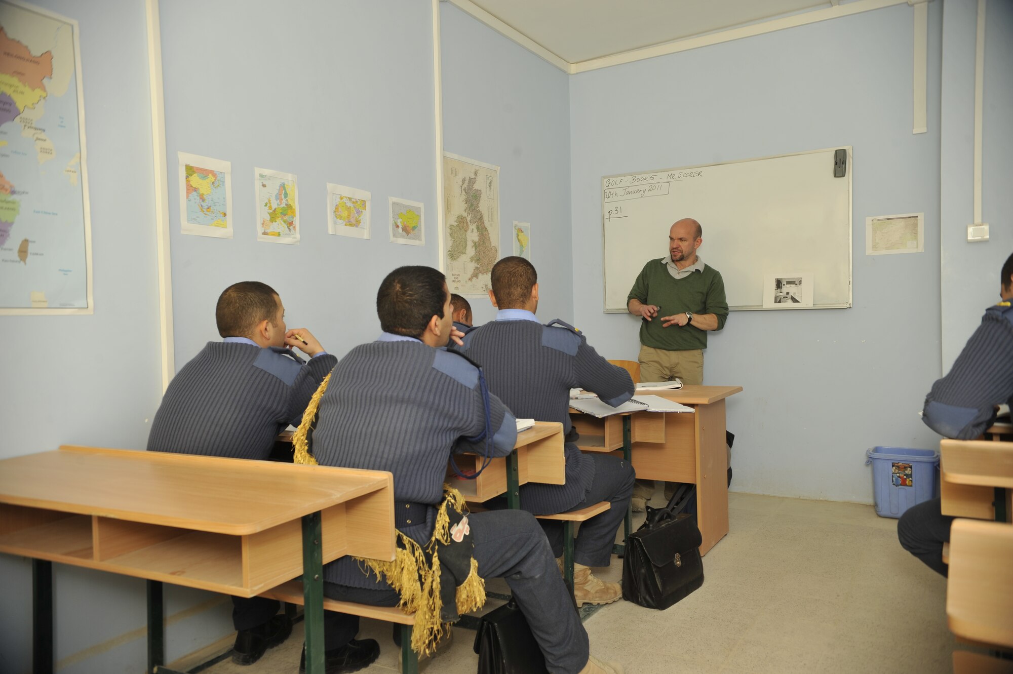 Cadet pilots in Class 76 at the Iraqi Air Force College, Tikrit, Iraq, listen to an English lesson from Marcus Scorer, English Language Training program trainer and site lead. The recently reopened academy for the Iraqi Air Force is housed inside a former dormitory for Iraqi officers. (U.S. Air Force photo by Senior Master Sgt. Larry Schneck/Released)