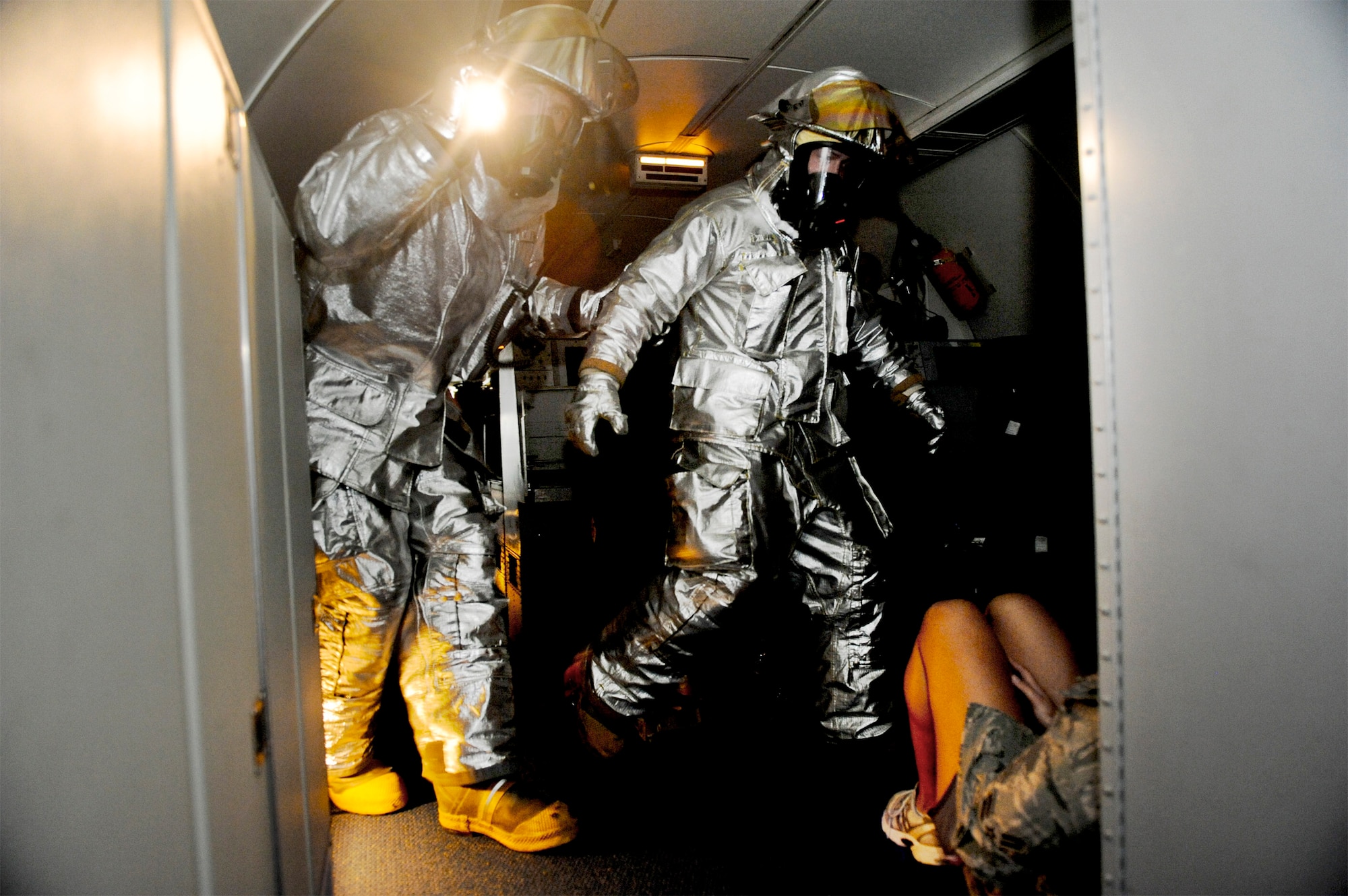 Firefighters from the 18th Civil Engineer Squadron search for victims aboard an E-3 Sentry during a simulated engine fire Jan. 19, 2011, at Kadena Air Base, Japan. The simulated engine fire was part of Beverly High 11-02, a local operational readiness exercise. (U.S. Air Force photo/Staff Sgt. Jonathan Steffen) 