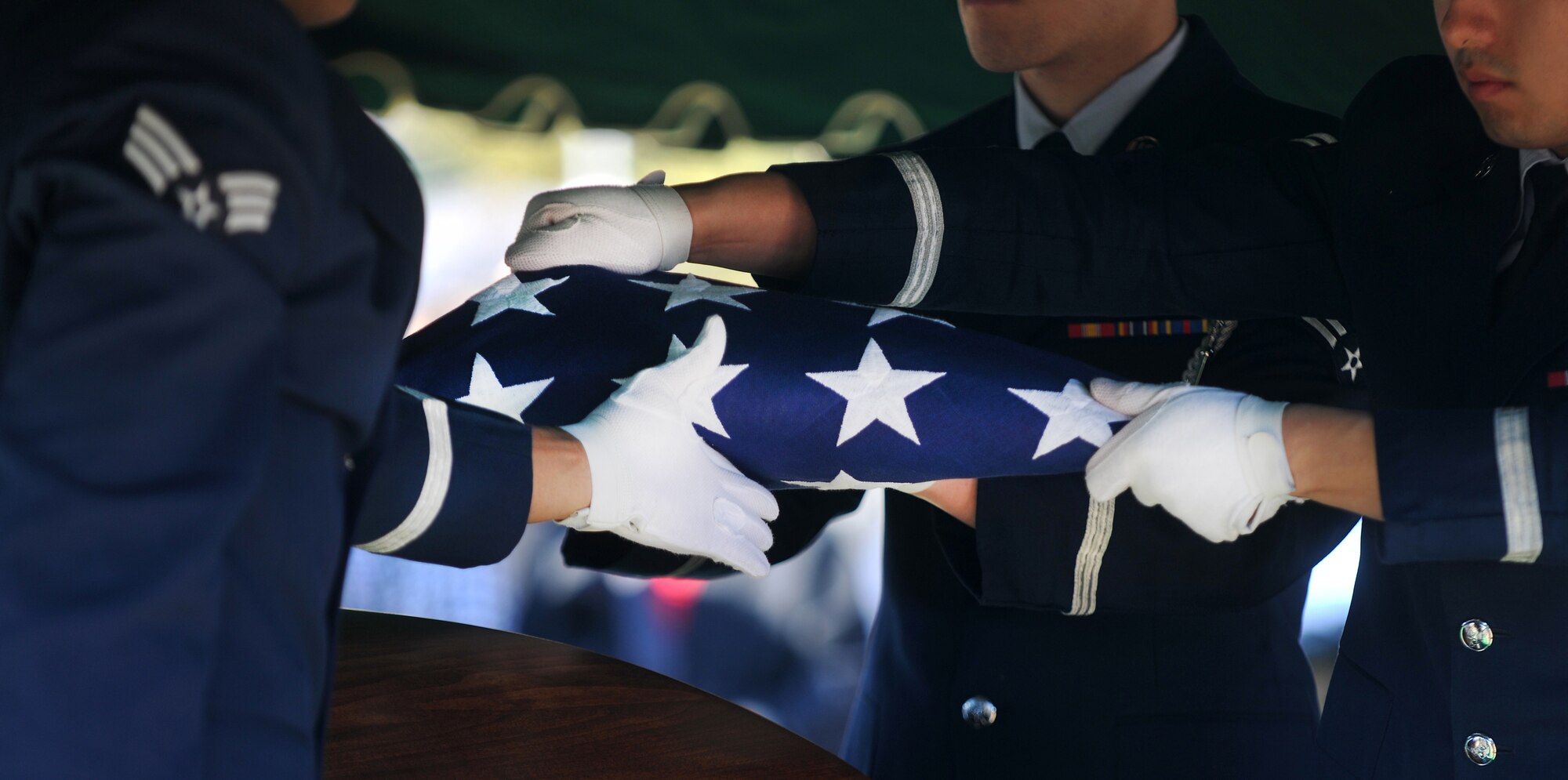 OZARK, Ala.-- Airmen from the Eglin Air Force Base Honor Guard finish folding a flag during a memorial service Jan. 22 in remembrance of 1st Lt. Robert Franklin Dees, a F-84E Thunderjet fighter pilot, whose aircraft was shot down over North Korea in 1952 during a combat mission. For all memorial services the flag over the casket is folded and given to the family members of the fallen military member as a sign of respect and honor to the family. (U.S. Air Force photo/Airman 1st Class Joshua Green)(RELEASED)
