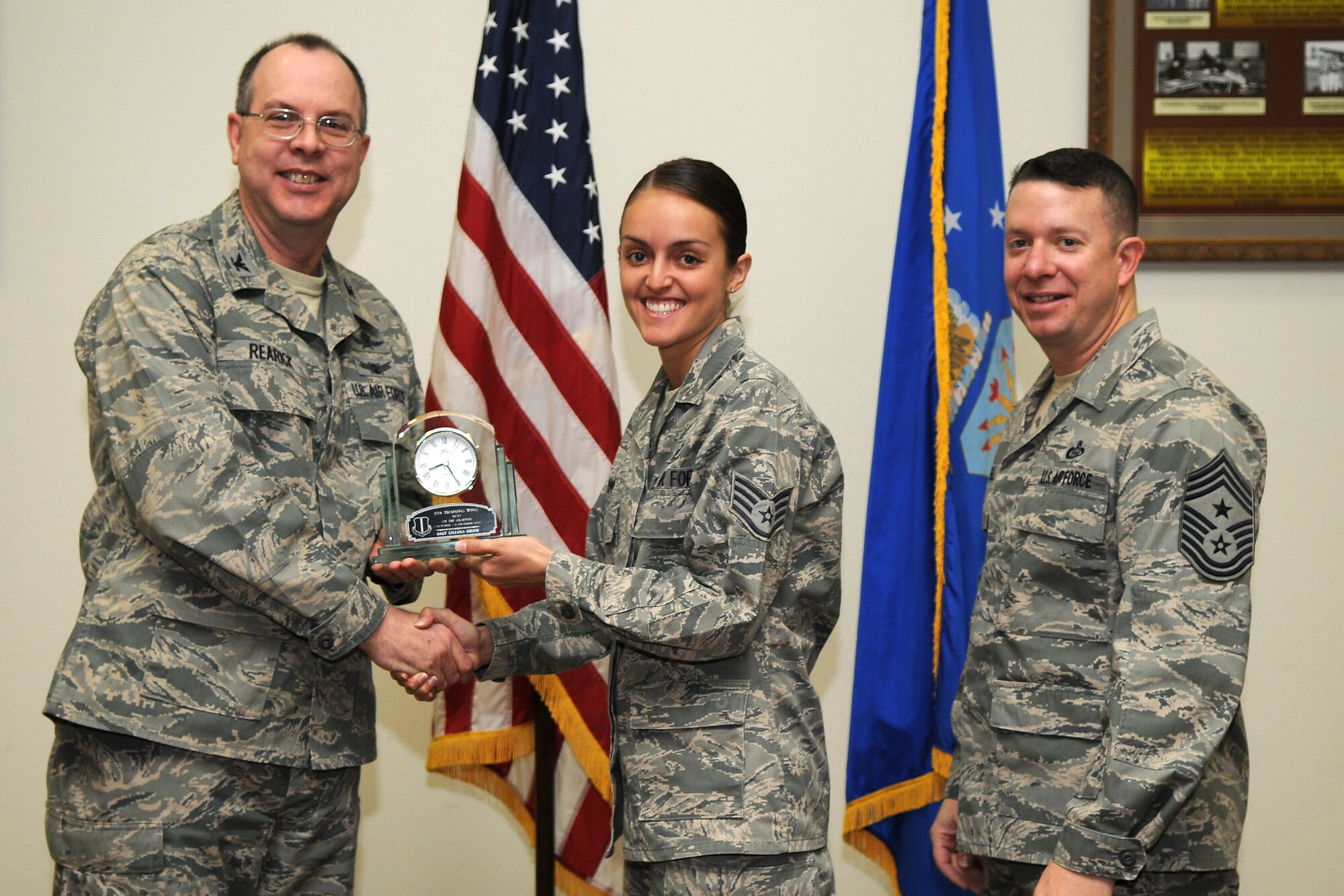 GOODFELLOW AIR FORCE BASE, Texas - Col. David Rearick, 17th Training Wing Vice Commander, and 17th TRW Command Chief, Chief Master Sgt. Brendan Criswell, present the NCO of the Quarter award to Staff Sgt. Liliana Drum, 17th Training Group, during the awards ceremony Jan. 25. (U.S. Air Force photo/Staff Sgt. Heather Rodgers)