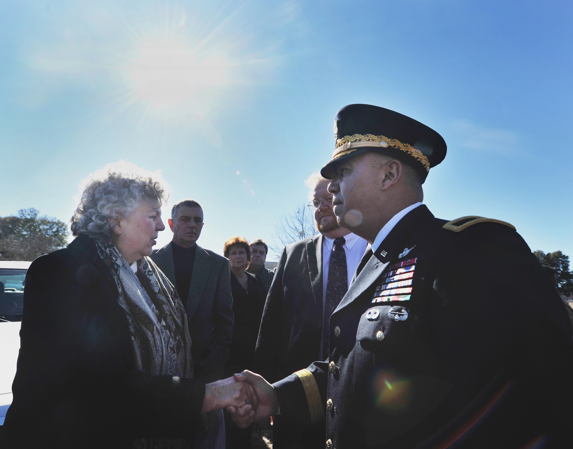 OZARK, Ala.-- Brig. Gen. Anthony Crutchfield, U.S. Army Aviation Center of Excellence commanding general, greets Linda Dee, niece of 1st Lt. Robert Franklin Dees, Jan. 22 before the start of a memorial service in remembrance of her uncle. Members from the Army and Air Force came and showed their support as well as their appreciation for the Dees family. (U.S. Air Force photo/Airman 1st Class Joshua Green)(RELEASED)
