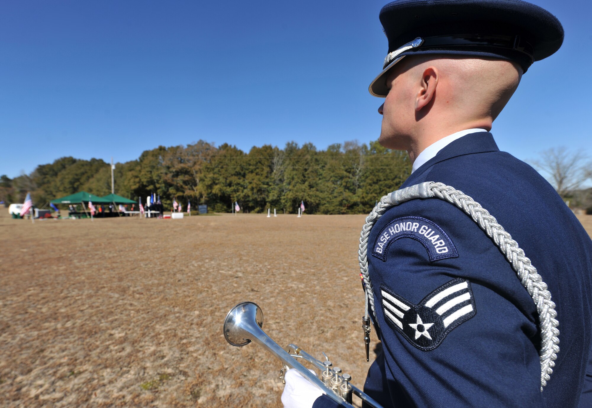 OZARK, Ala.-- Senior Airman Nicholas Cooper, Honor Guard trumpet player from Eglin Air Force Base, Fla., stands in his designated position Jan. 22 before the start of a memorial service in remembrance of 1st Lt. Robert Franklin Dees, F-84E Thunderjet fighter pilot whose aircraft was shot down over North Korea during a combat mission. Lieutenant Dees was assigned to the 430th Fighter-Bomber Squadron, 474th Fighter Bomber Group. (U.S. Air Force photo/Airman 1st Class Joshua Green)(RELEASED)
