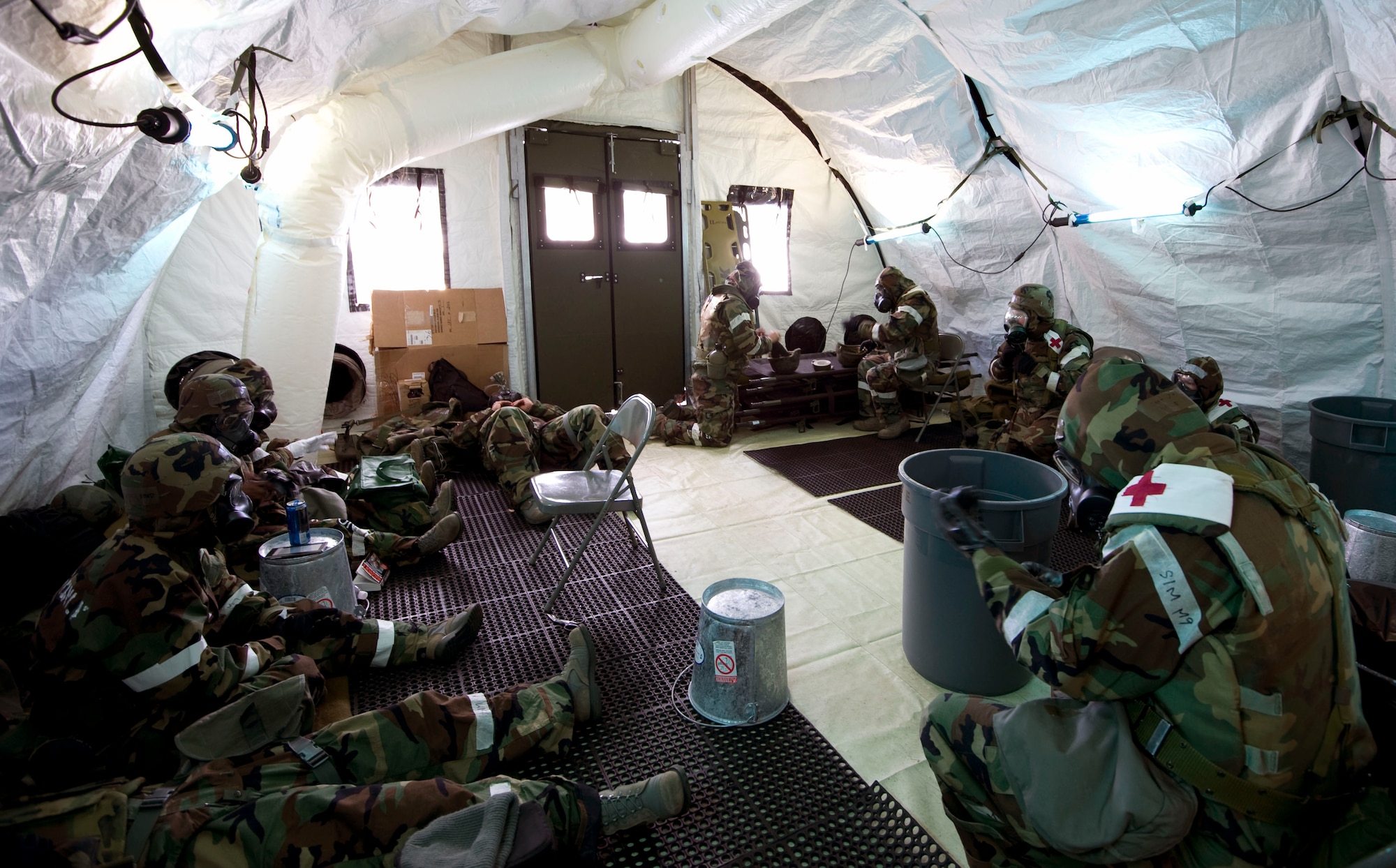U.S. Air Force Airmen from the 35th Medical Group respond to a simulated chemical attack at Misawa Air Base, Japan, Jan. 25, 2011. The simulated attack was part of the first operational readiness exercise of 2011 for Misawa AB. (U.S. Air Force photo by Tech. Sgt. Russell McBride/Released) 